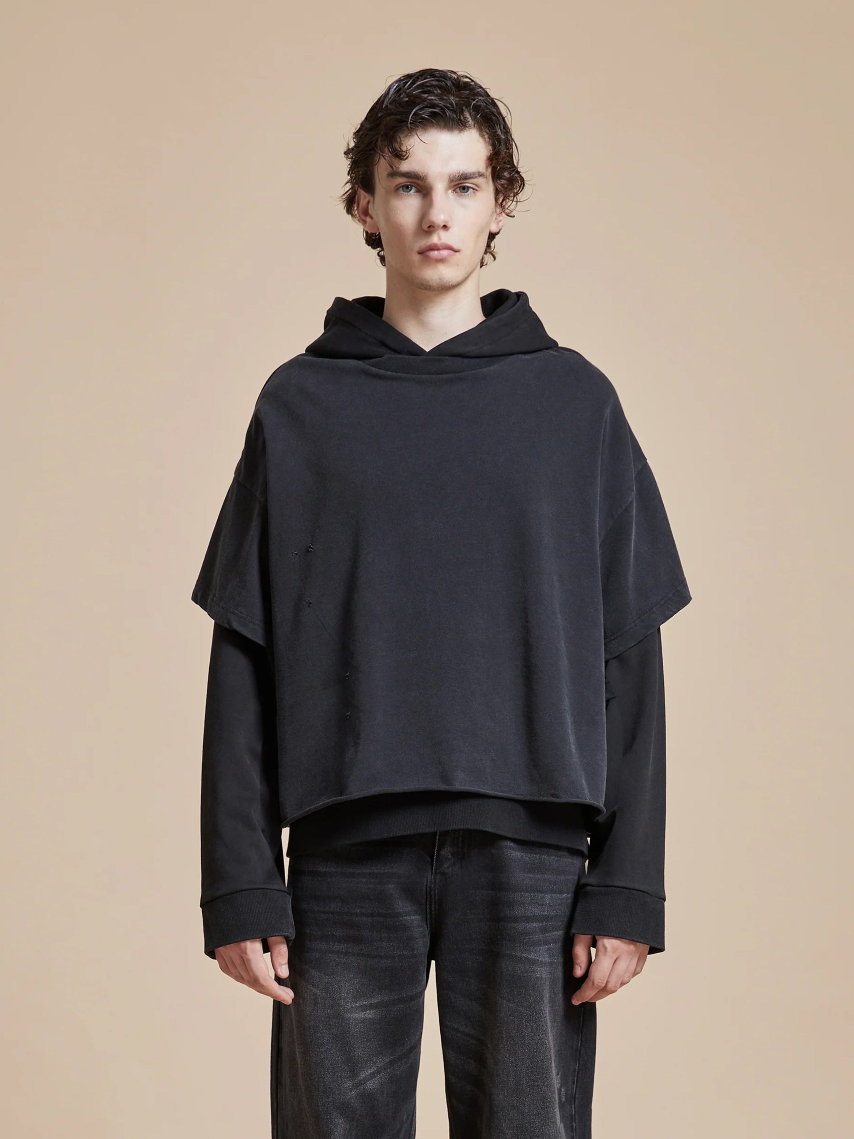The model is wearing a Found Double Layer Hoodie.