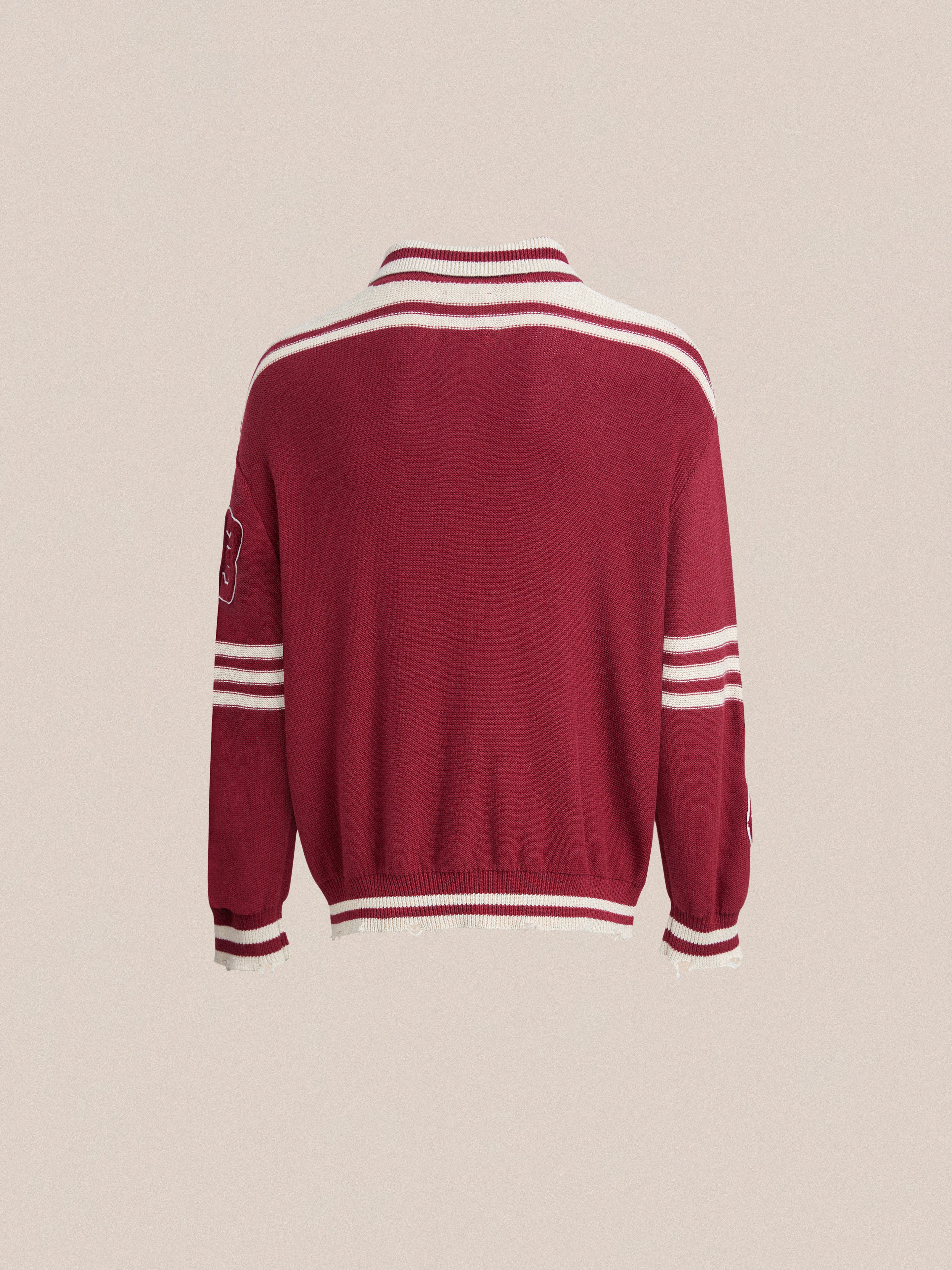 The back of a red sweater with white stripes features a Found Fin Varsity Patch Collared Cardigan.