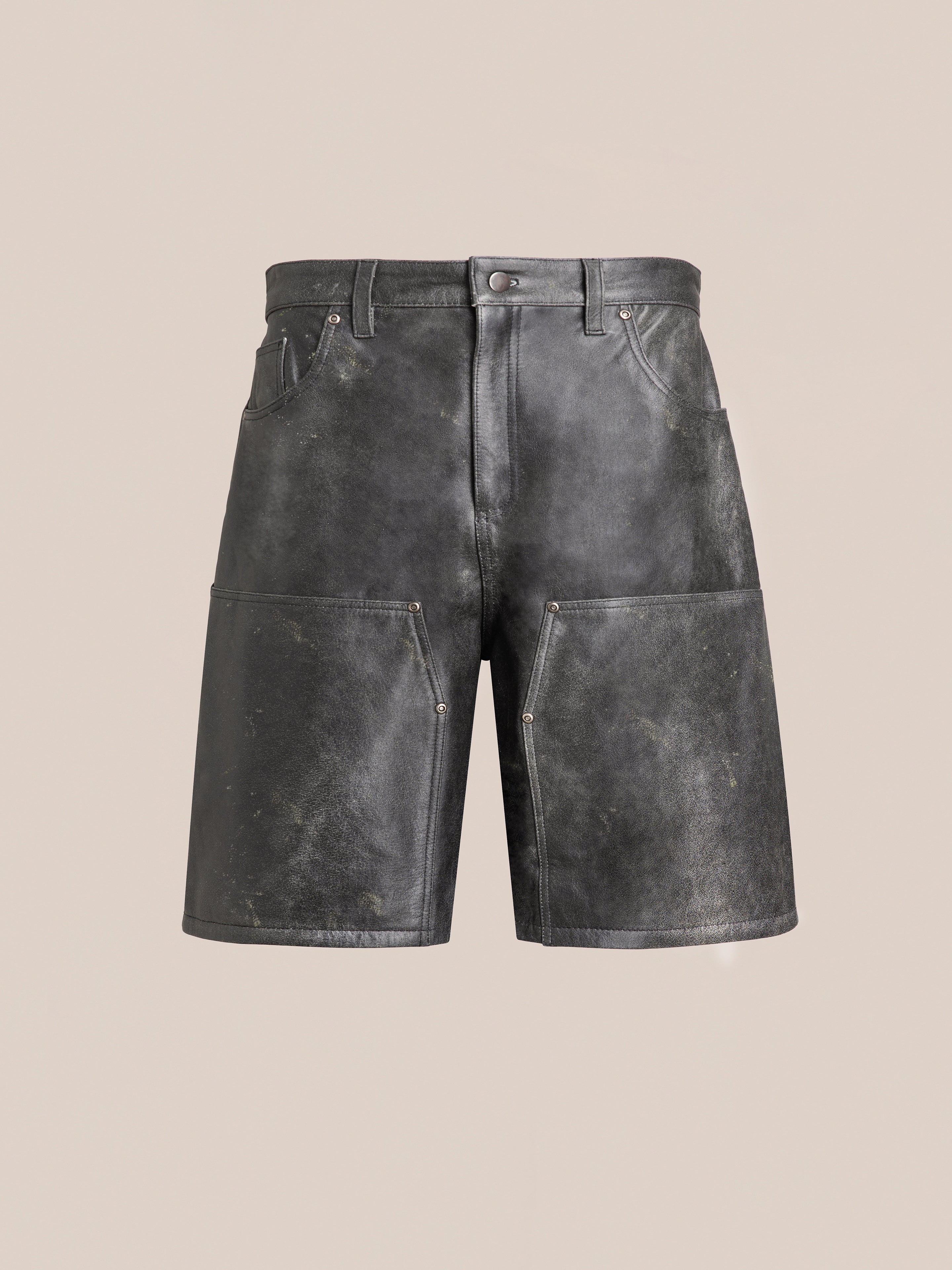 Distressed Genuine Leather Carpenter Shorts by Found, showcasing visible creasing and pocket detailing, crafted from ethically sourced materials, set against a plain beige background.