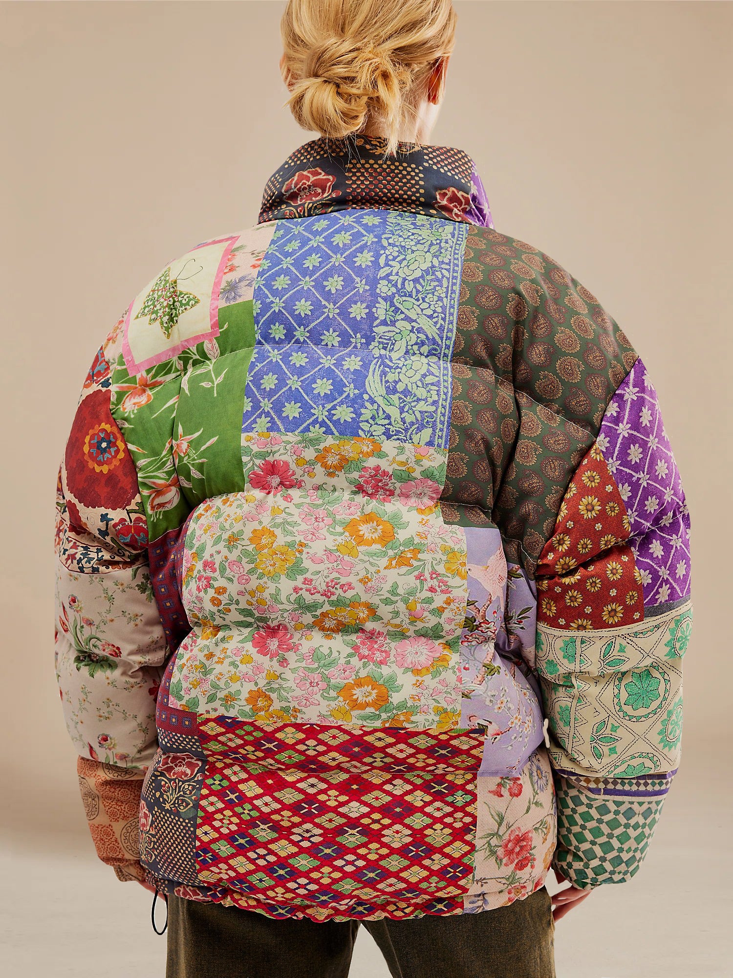 A woman wearing a Found Gardenia Tapestry Puffer Jacket.