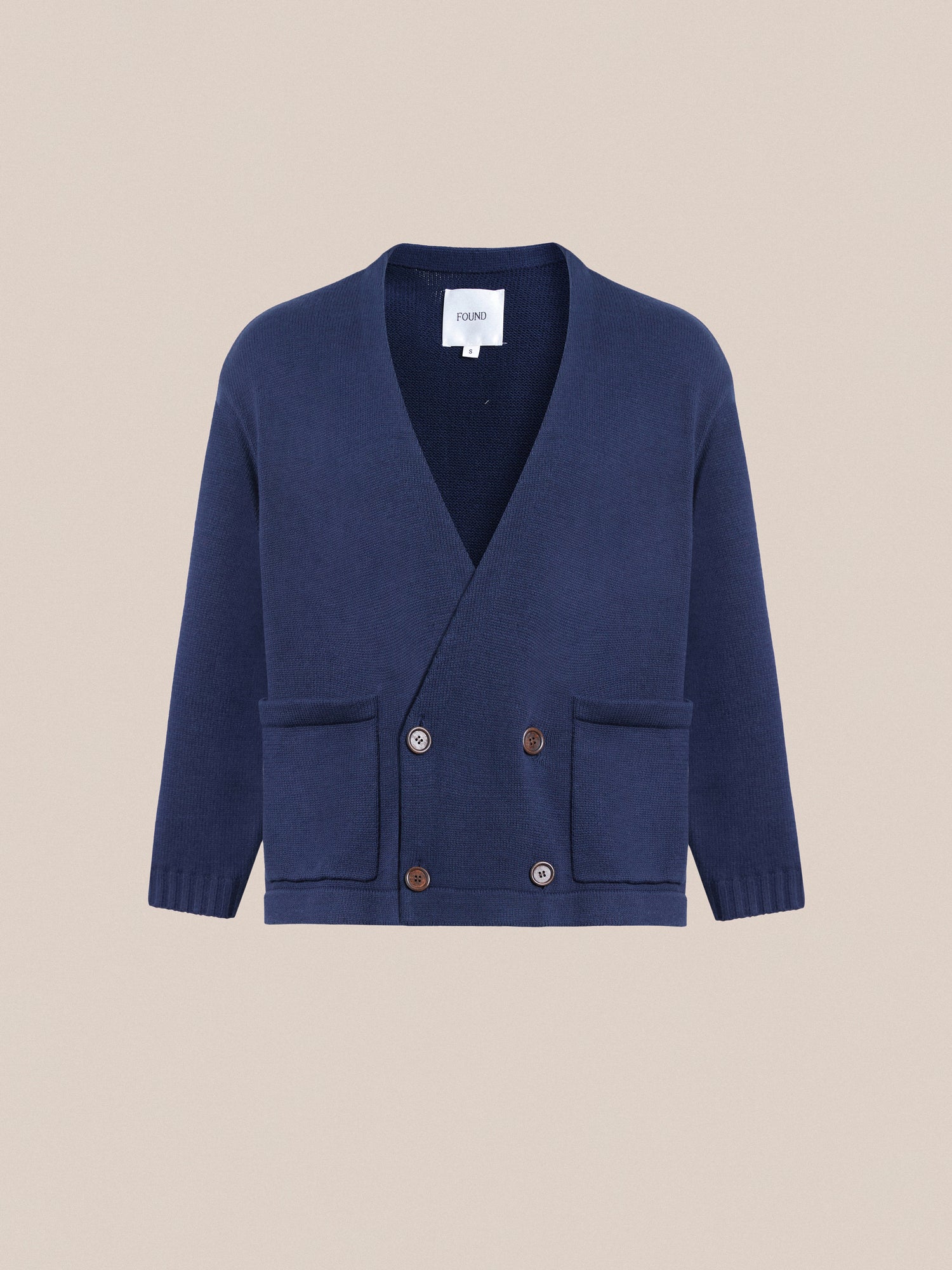 A blue Larsi Double Breasted Knit Cardigan with buttons on the front.