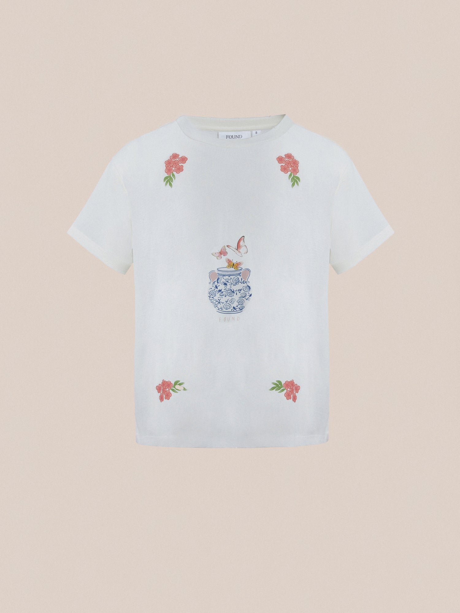 A white Found Flower Pot Tee with a flower embroidered on it, exuding springtime charm.