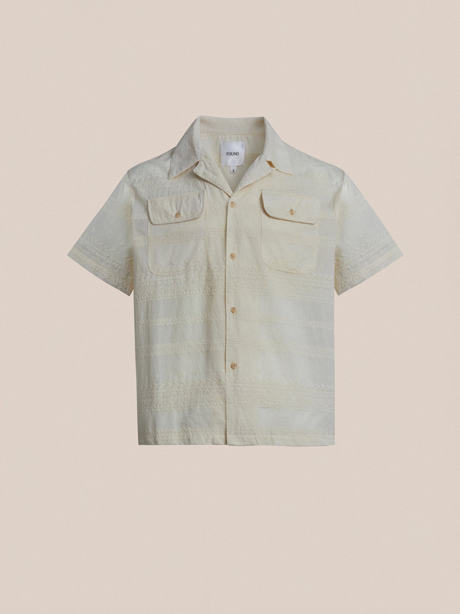 The men's short sleeve Lace SS Camp Shirt in beige from Found features delicate lace detailing.