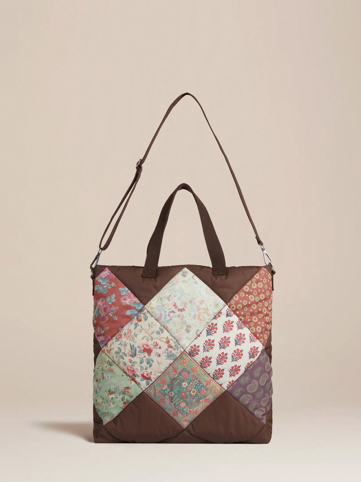 A brown Parisa Quilted Tapestry Bag from Profound.