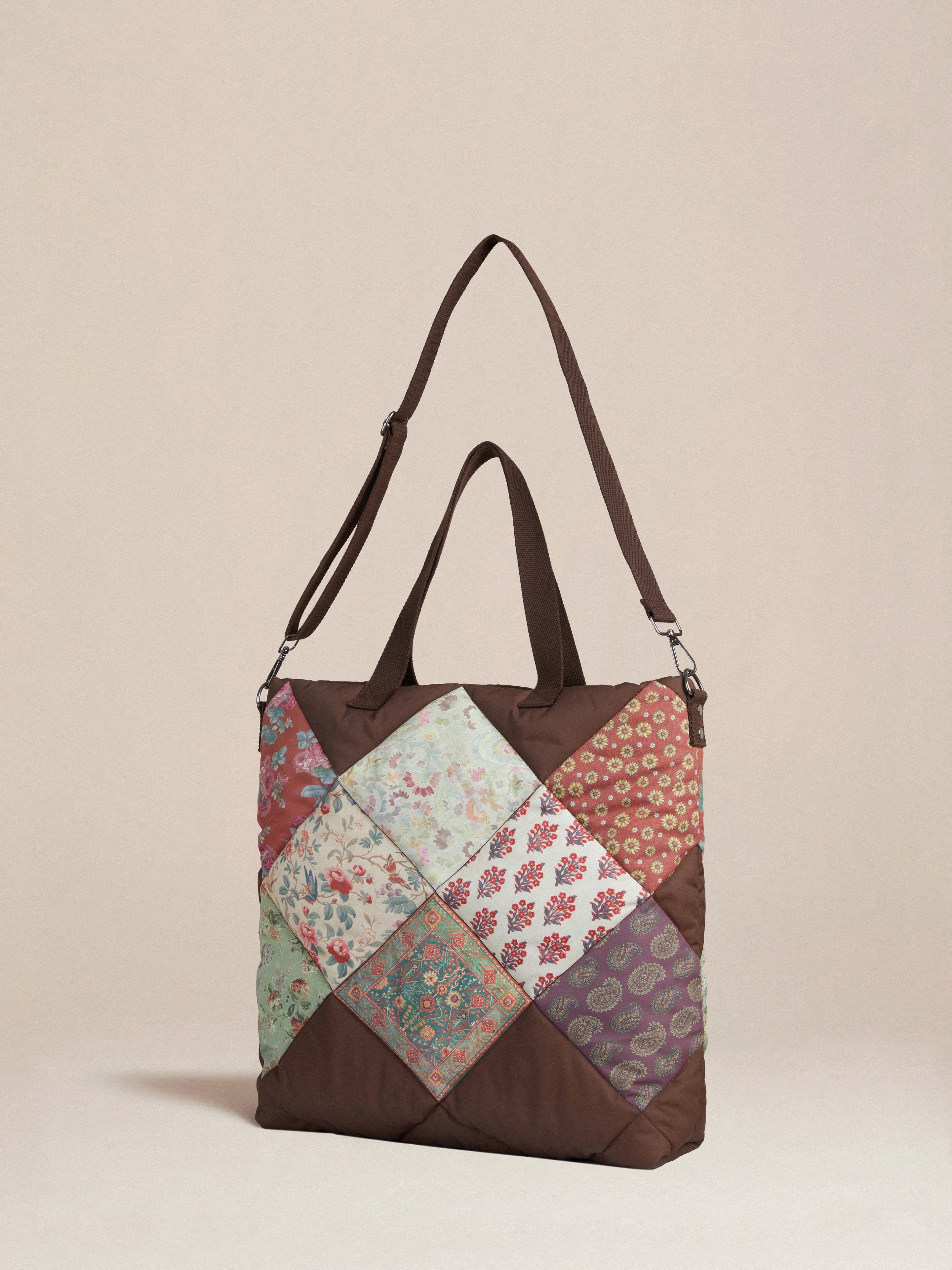 A brown Parisa Quilted Tapestry Bag with a patchwork pattern on it, featuring South Asian prints by Profound.