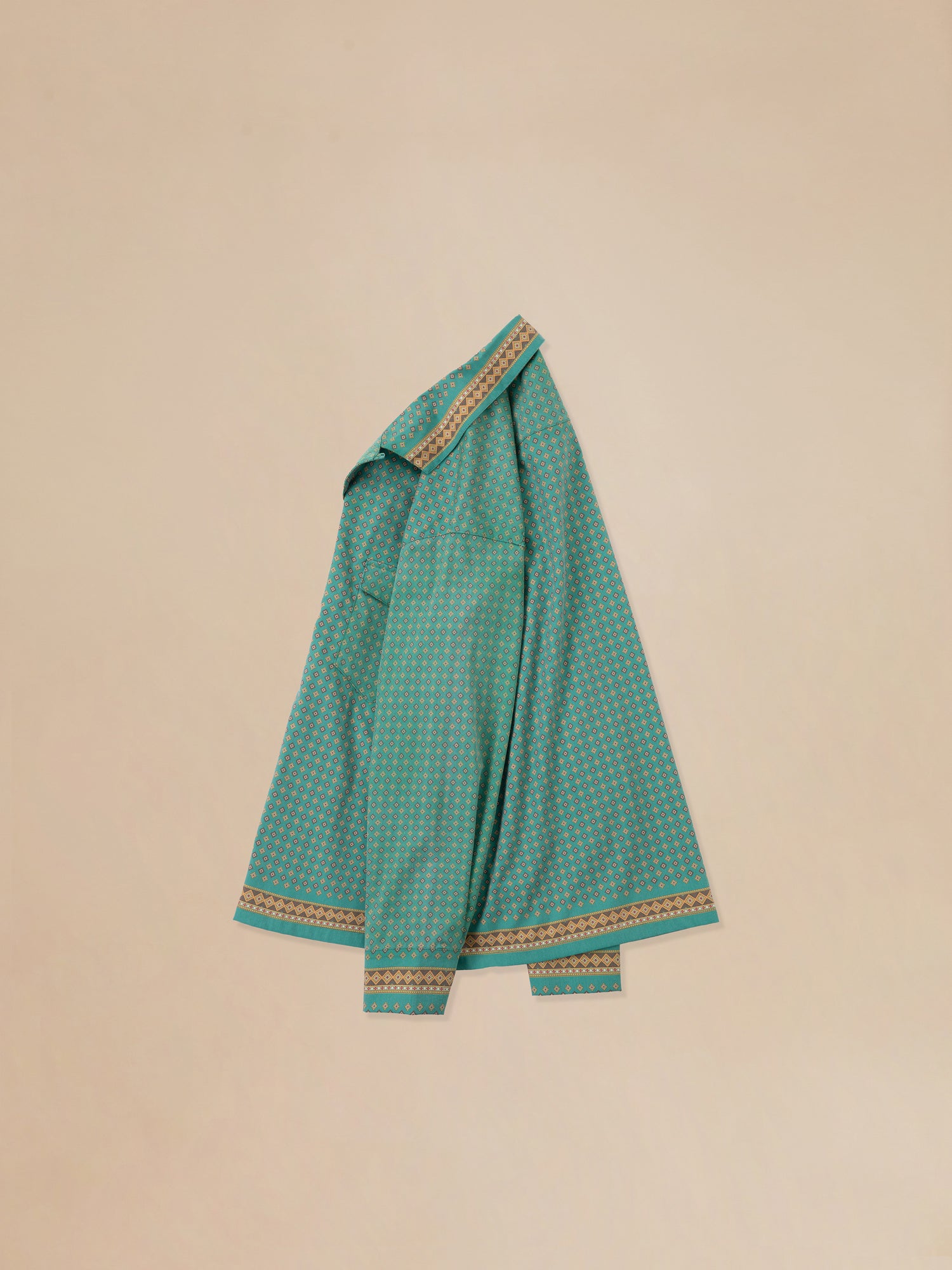 A green checkered Found Arbor Long Sleeve Camp Shirt on a beige background.