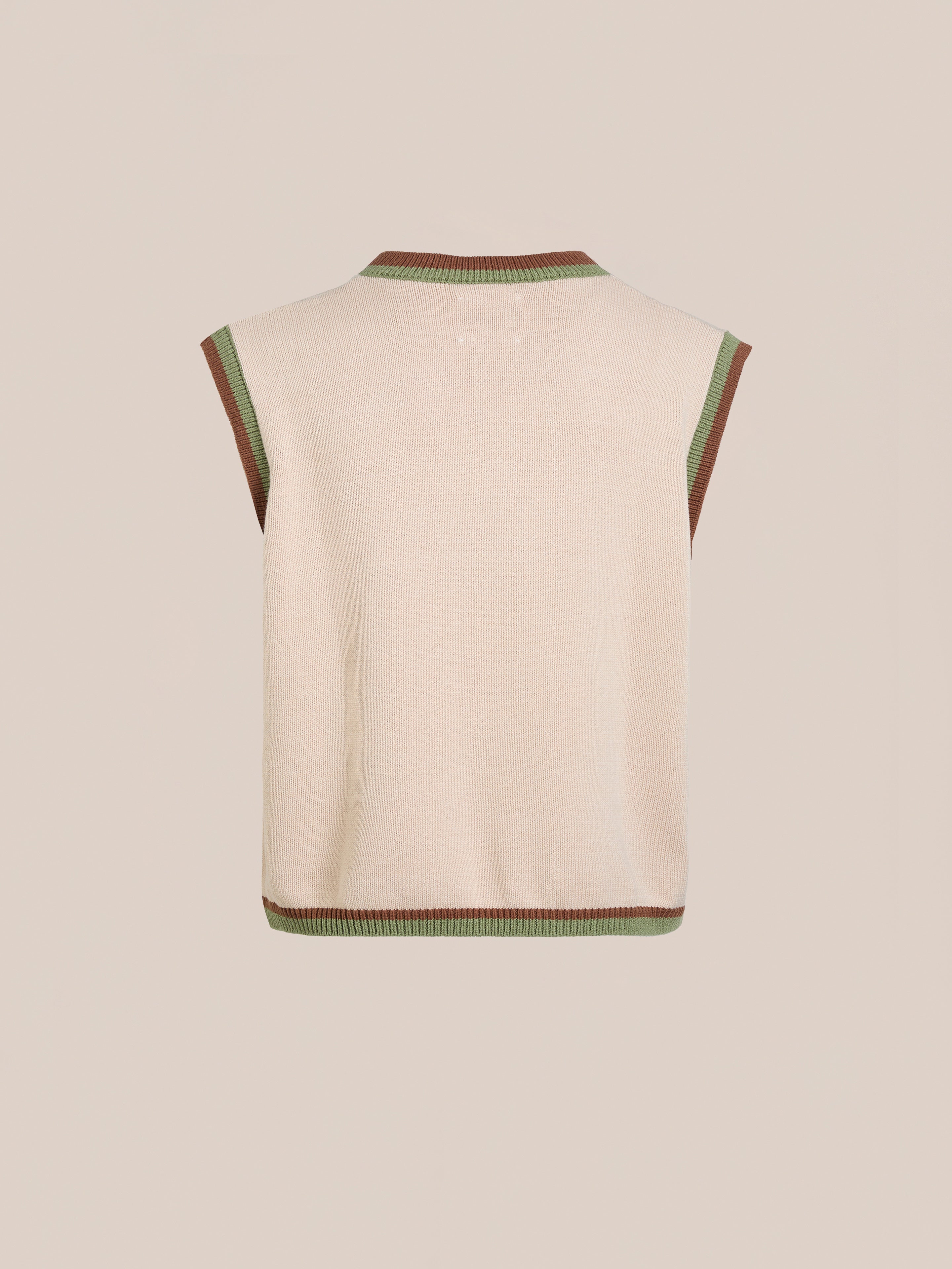 FOUND's Argyle Knit Vest is a sleeveless beige sweater vest with a vintage-inspired diamond pattern, featuring green and brown trim on a plain background, offering a relaxed fit for all genders.