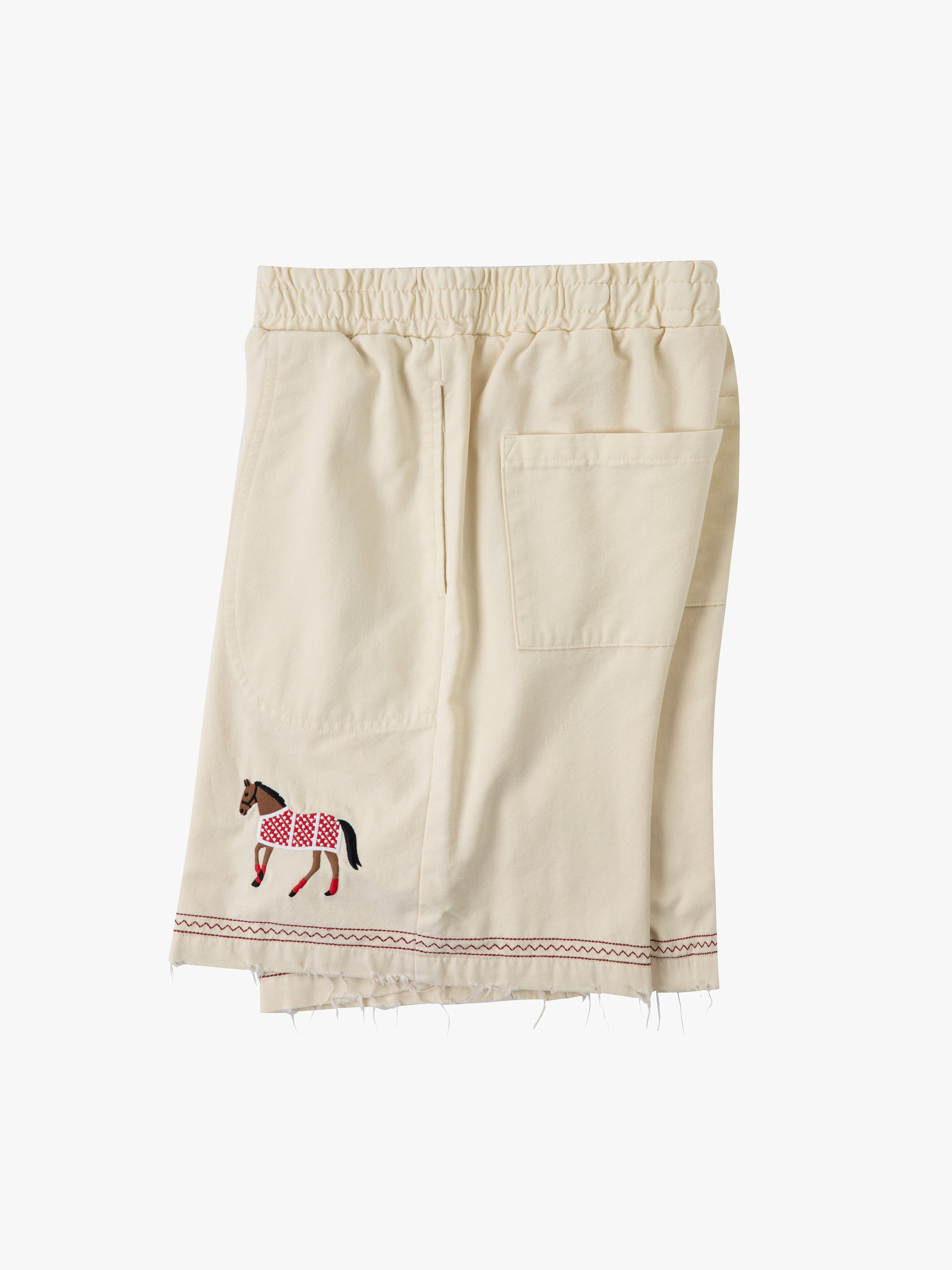 Beige shorts from Profound, crafted from cotton twill, feature an elastic waistband, a large front pocket, and beautiful embroidered horse motifs at the hemline.