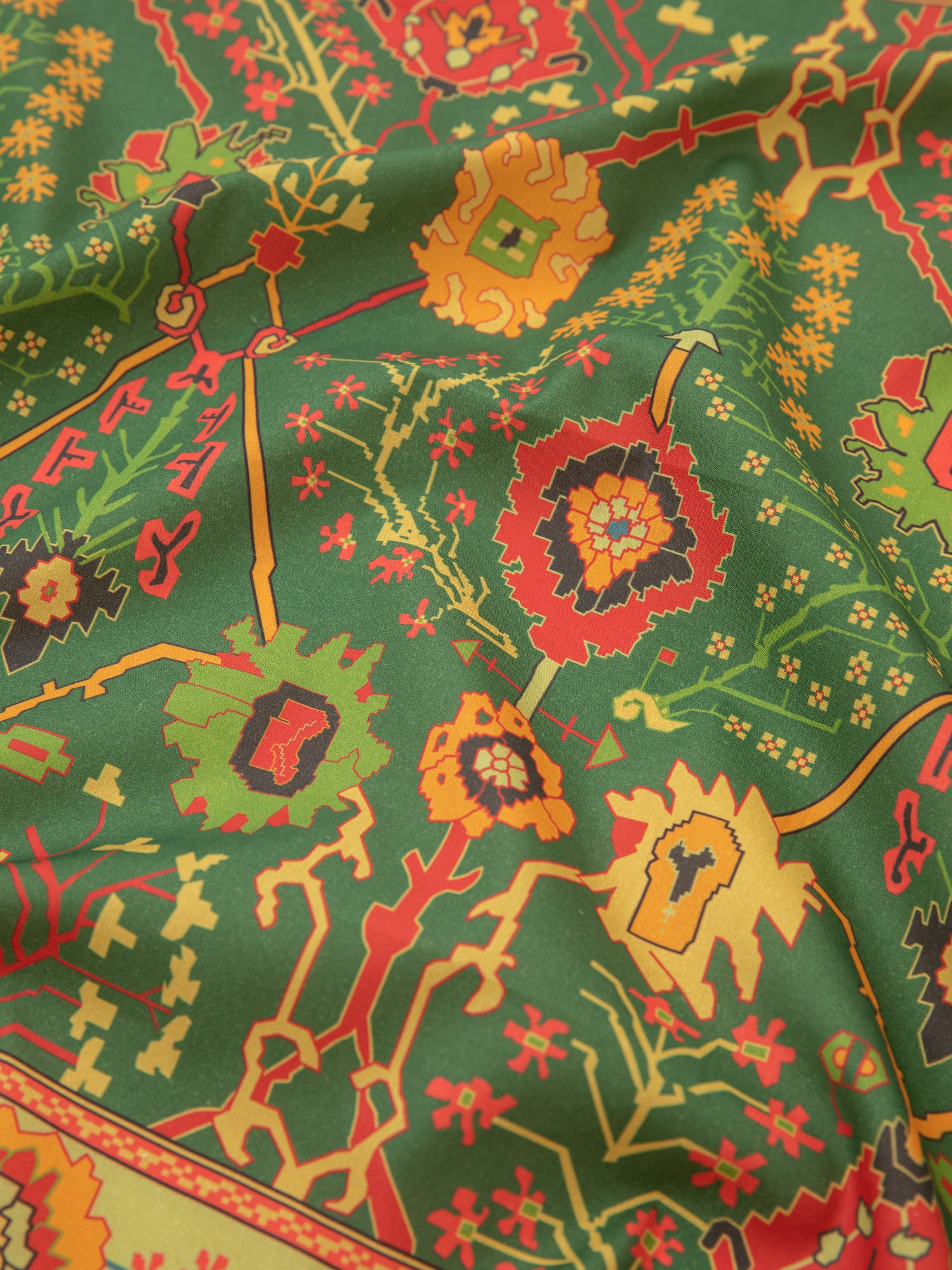 A close up of a Botanical Mosaic Bandana fabric with Indo-Aryan prints. (Brand: Found)