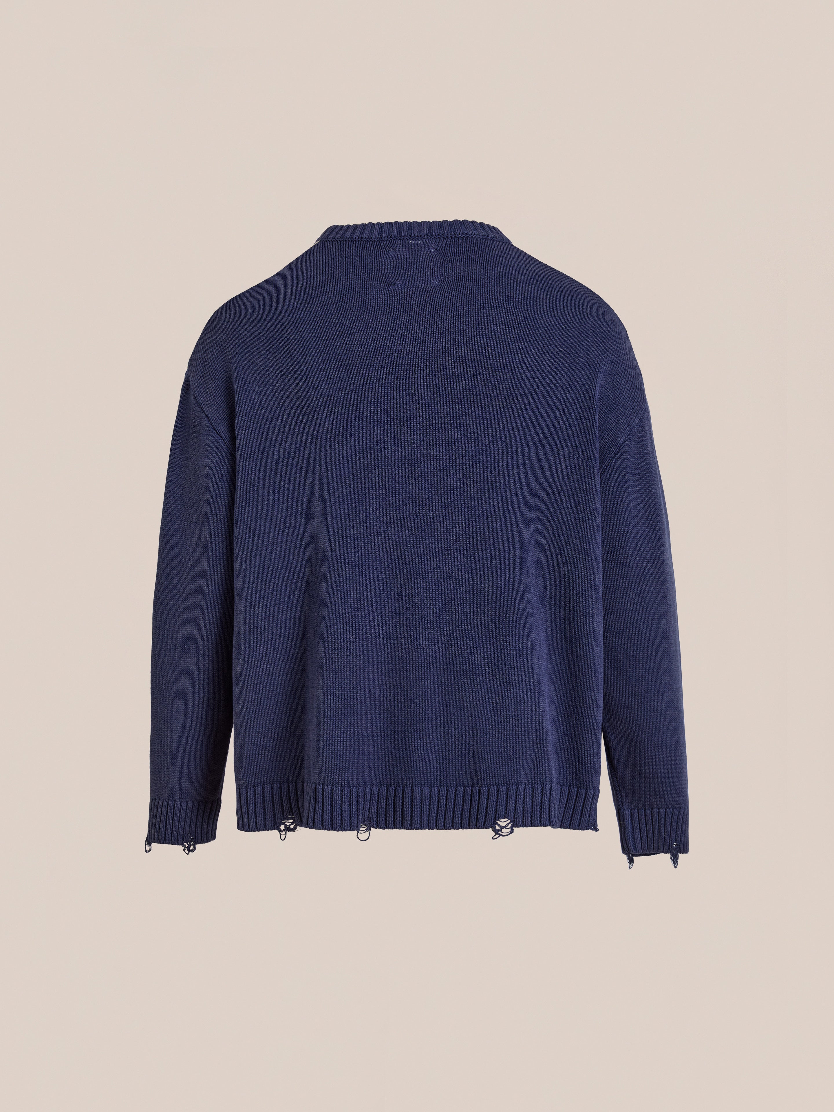The Found Checkered Fisherman Sweater in navy blue knit is shown from the back, featuring ribbed cuffs and hem, a relaxed fit, and small metal hardware along the bottom edge.