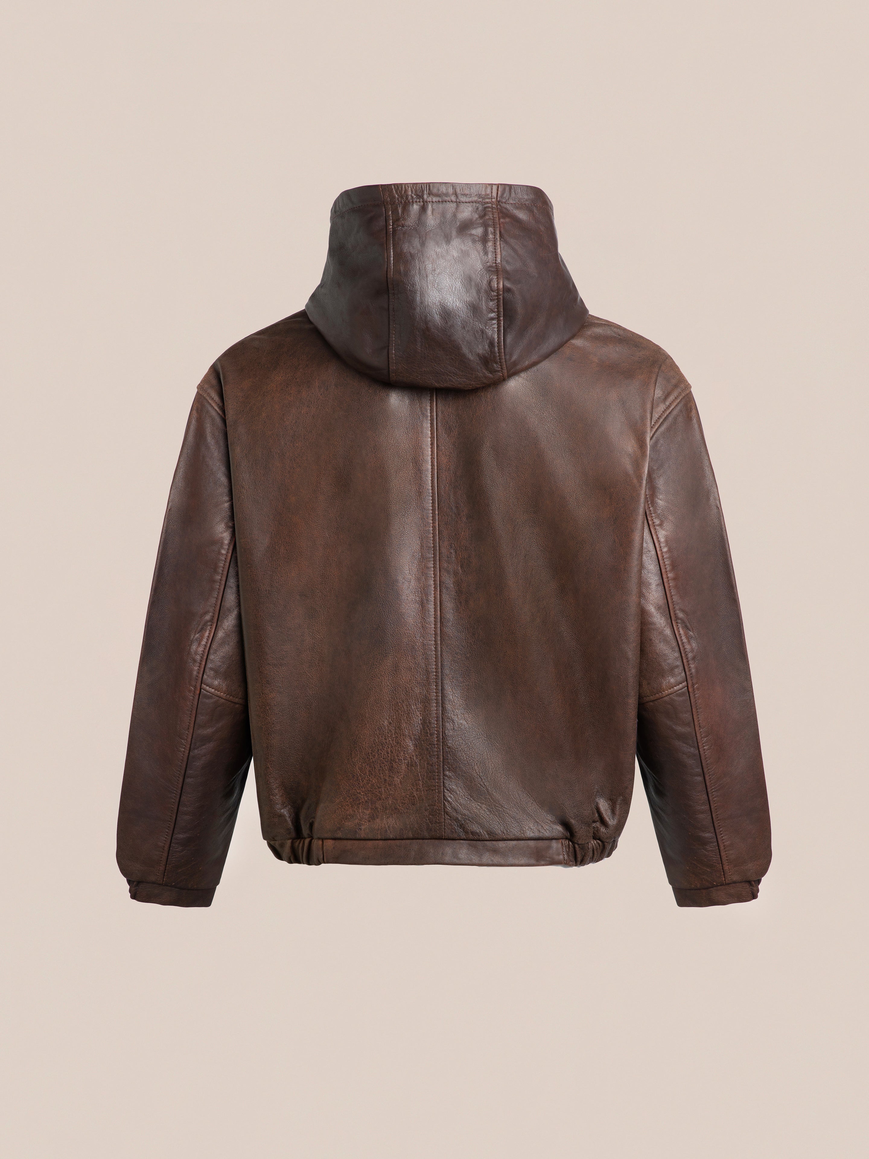 The Dusk Distressed Genuine Leather Hoodie by FOUND is shown from the back, in rich brown against a plain beige background. Crafted with ethically sourced materials, it effortlessly combines style and conscience.