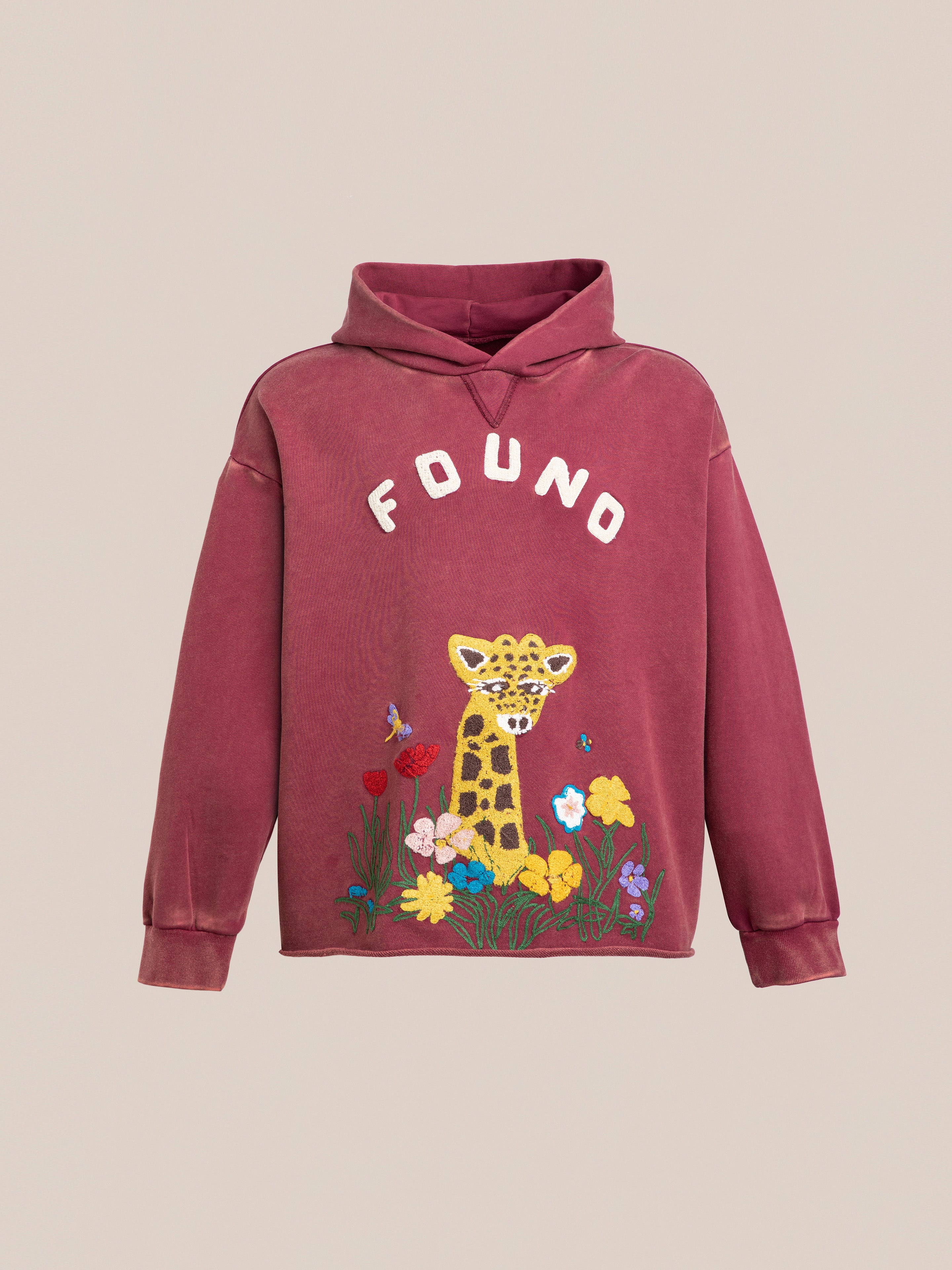 The FOUND Unisex Embroidered Wildlife Hoodie in burgundy features a relaxed fit with a giraffe graphic and delicate flower and insect embroidery. The word "FOUND" elegantly appears above the giraffe's head.