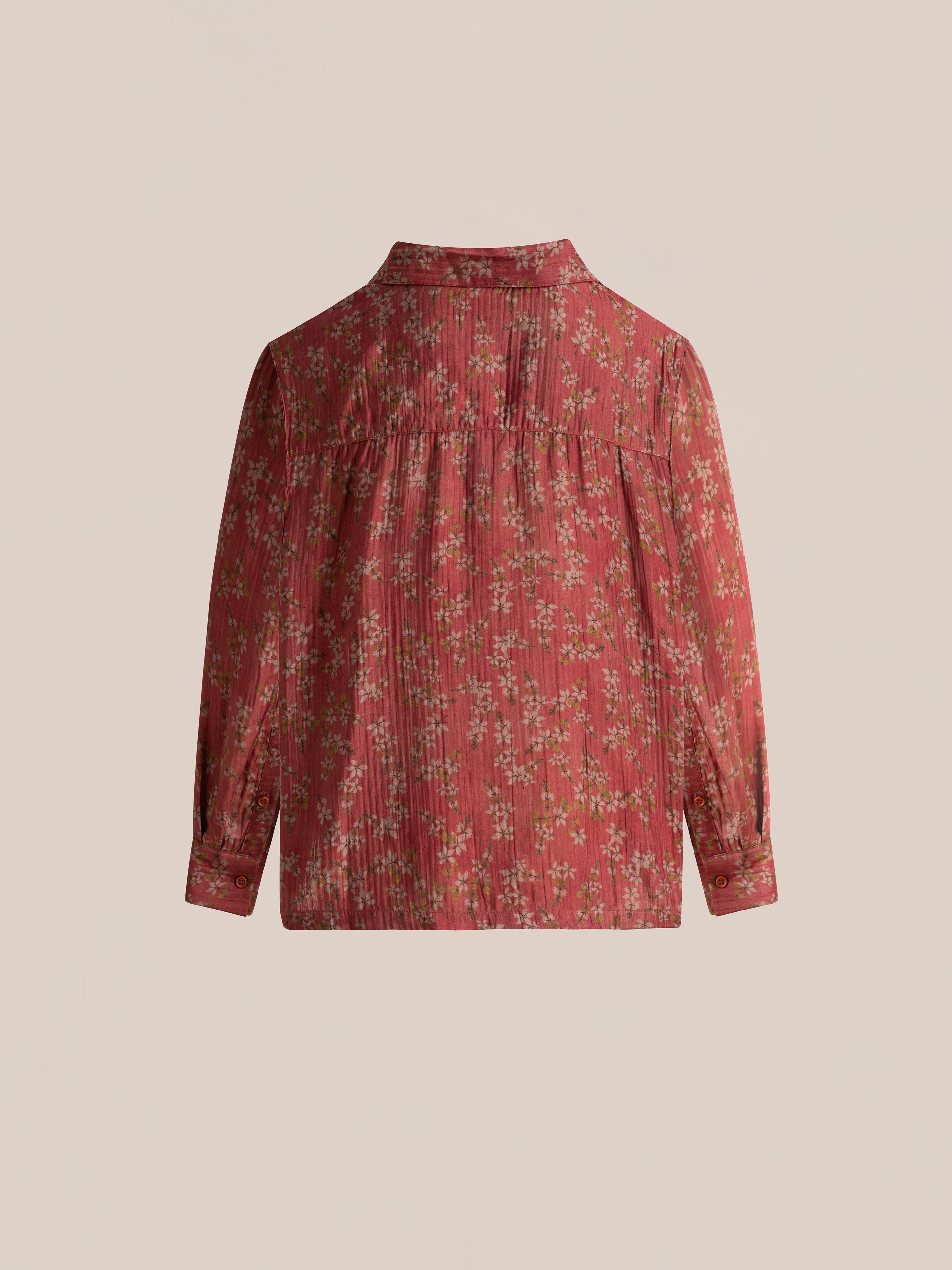 FOUND's Charlot LS Camp Shirt in red floral, featuring a pleated front and back, dual chest pockets, buttoned cuffs, and a collar, displayed against a plain background.