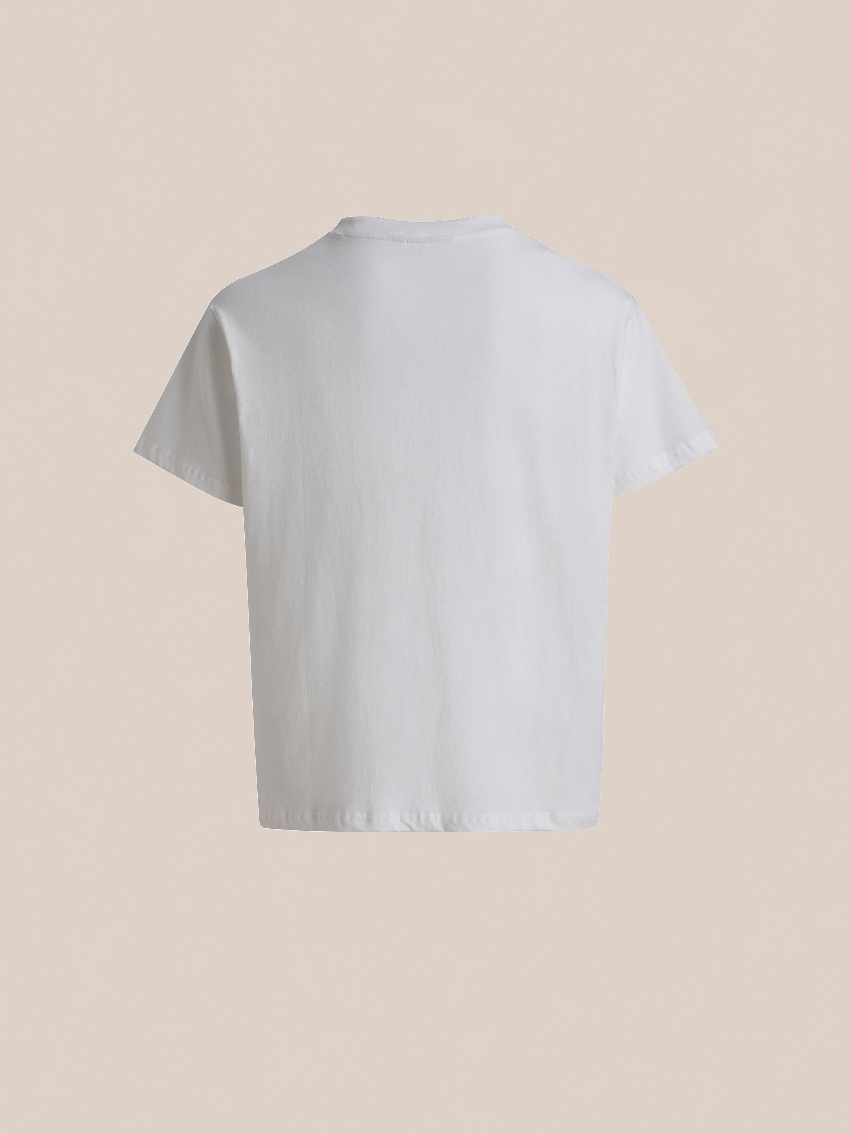 A plain white Rodeo Tee by FOUND, photographed from the back against a neutral background, exudes a timeless vintage feel.