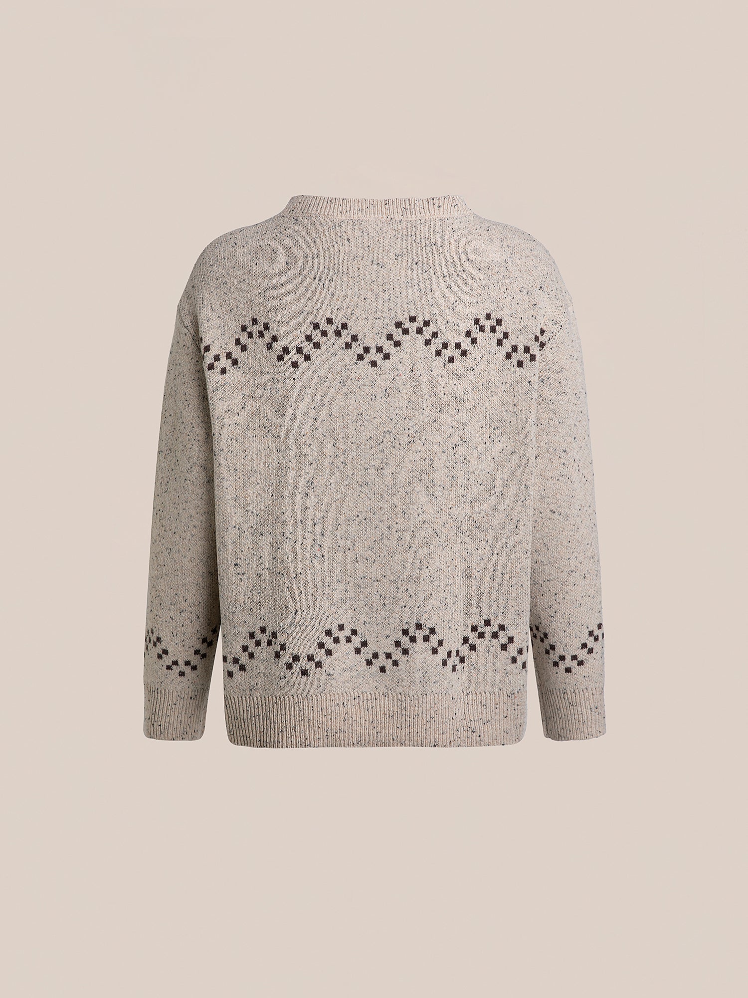 Back view of the Speckled Knit Horse Sweater by FOUND, showcasing a brown zigzag pattern across the chest and sleeves on a cozy beige speckled wool blend.