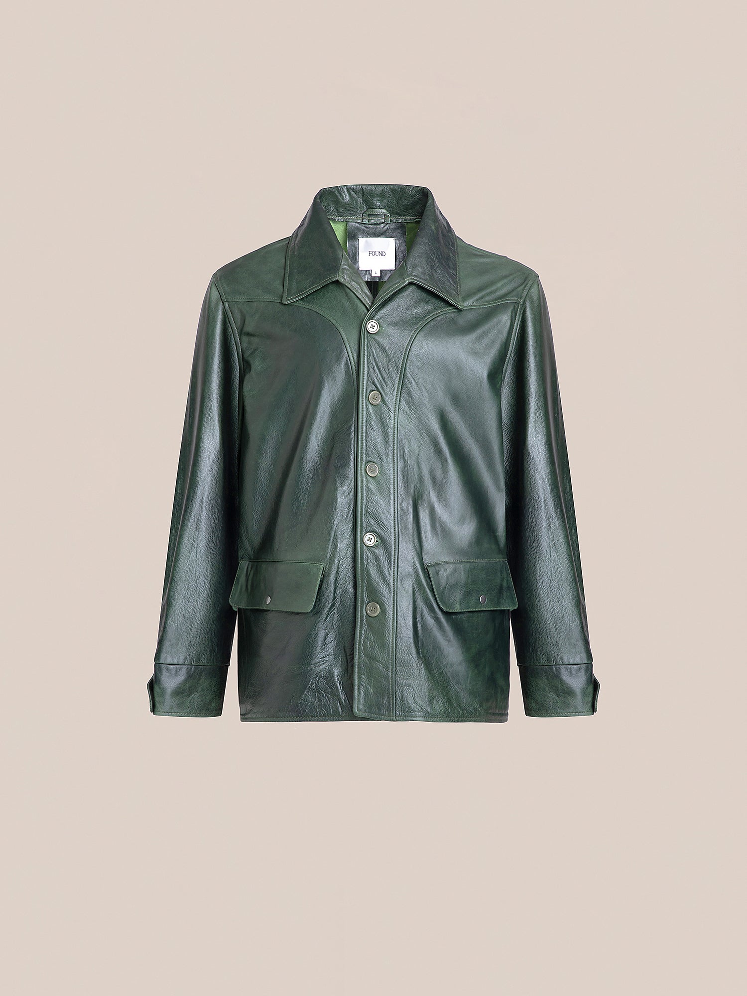 The FOUND Emerald Leather Jacket is a lightweight cowhide button-up with a collared neckline and two front pockets, blending fashion and function.