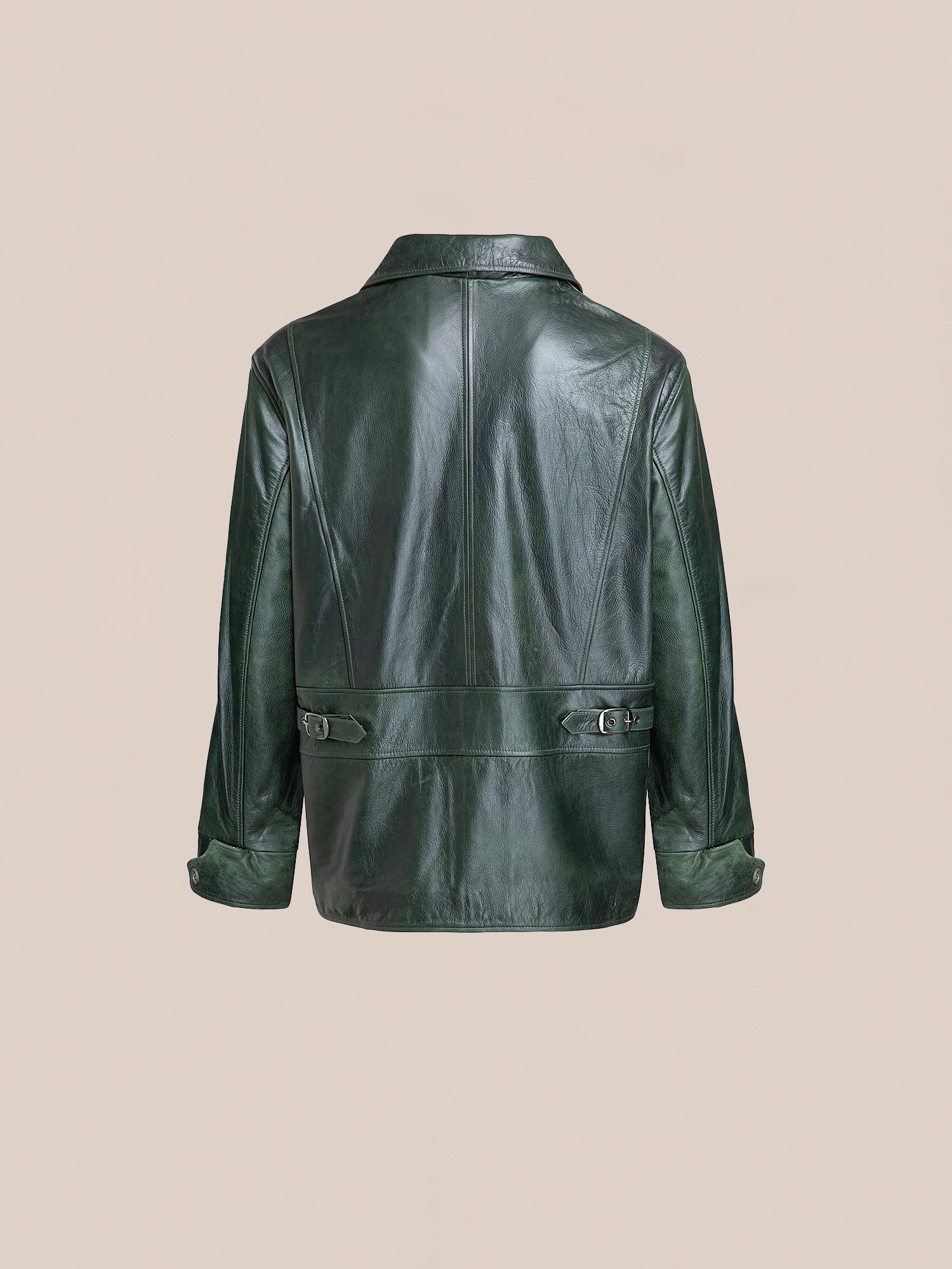 Back view of the FOUND Emerald Leather Jacket, made from lightweight cowhide, with long sleeves and buttoned cuffs, set against a plain beige background.