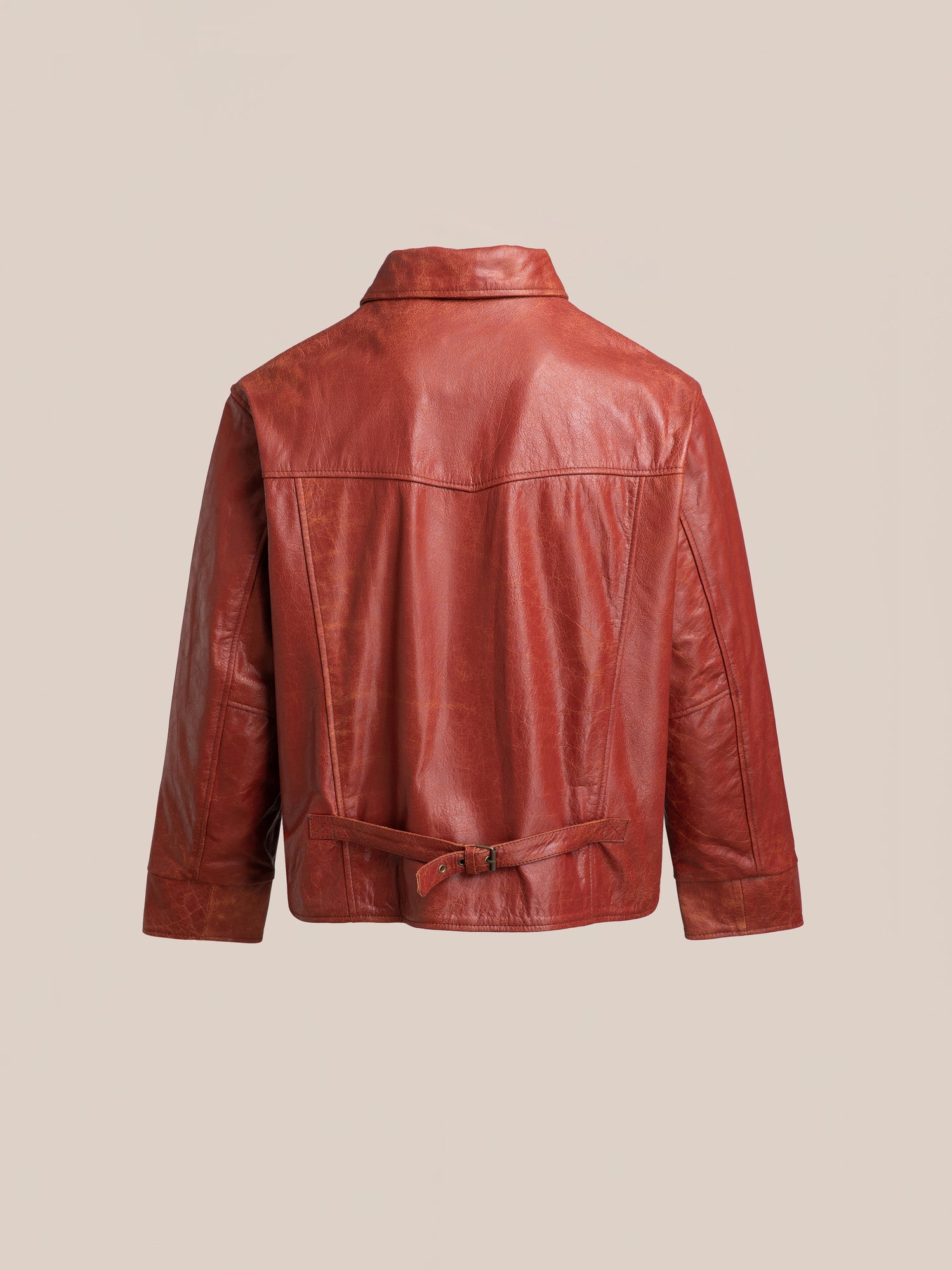 Back view of the Marlboro Sun Faded Leather Racer Jacket by FOUND, crafted from ethically sourced materials and featuring a belt detail at the waist, displayed against a beige background.