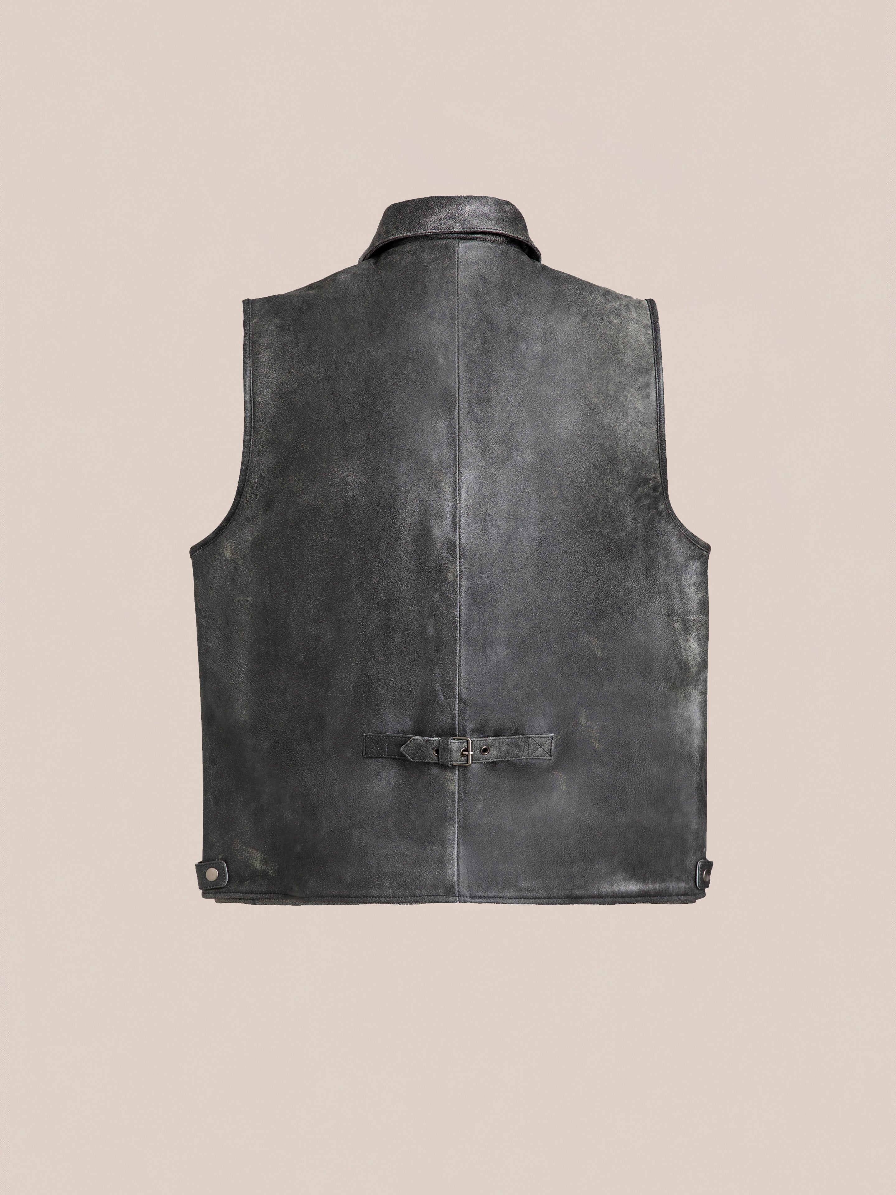 Back view of the Distressed Genuine Leather Pocket Vest by Found, featuring a buckle detail on the lower back, crafted from ethically sourced materials, shown against a neutral background.