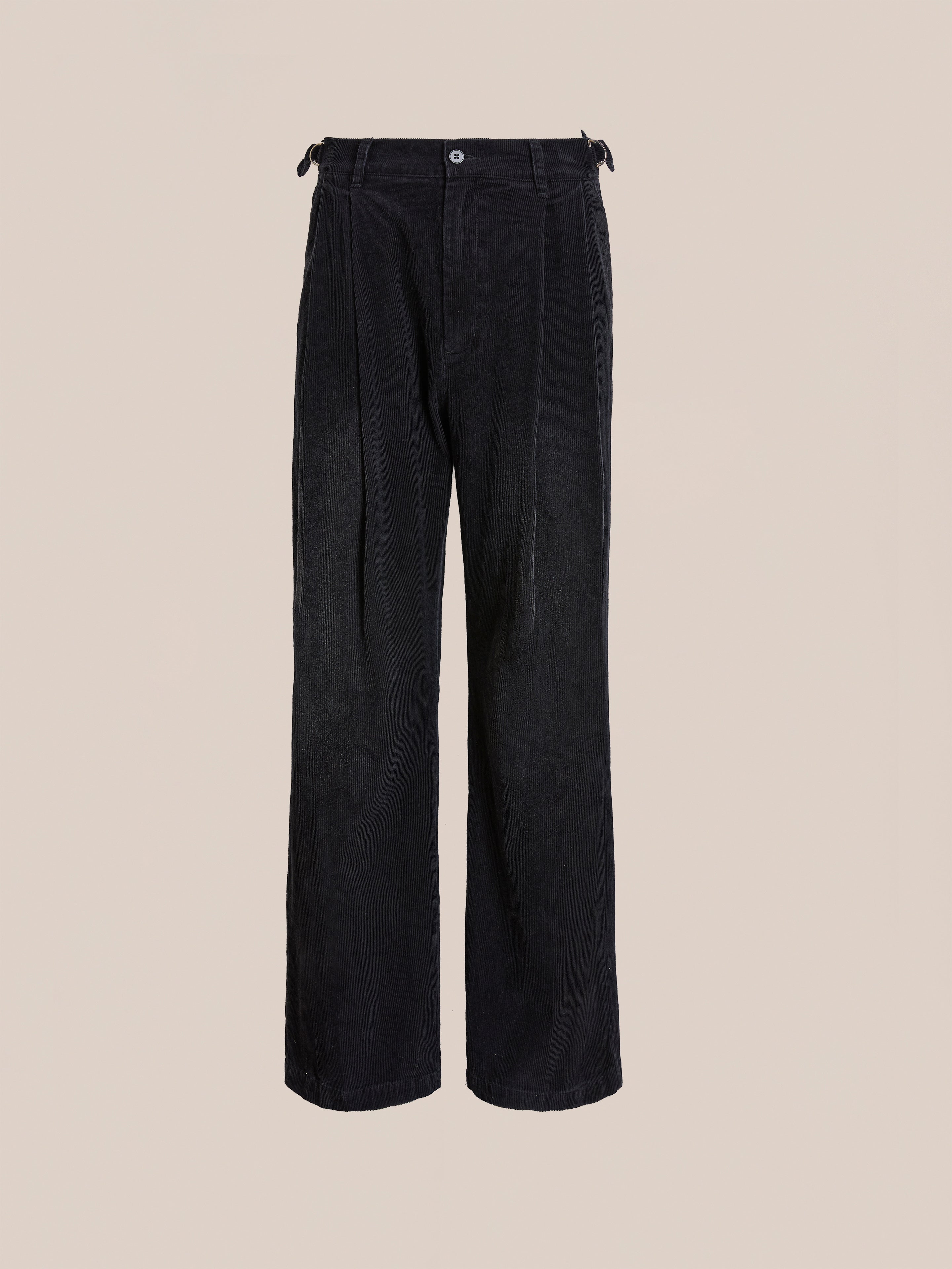 The FOUND Faded Pleated Corduroy Pants feature a high waist, wide legs, double pleats, and a button closure, shown against a plain beige background.