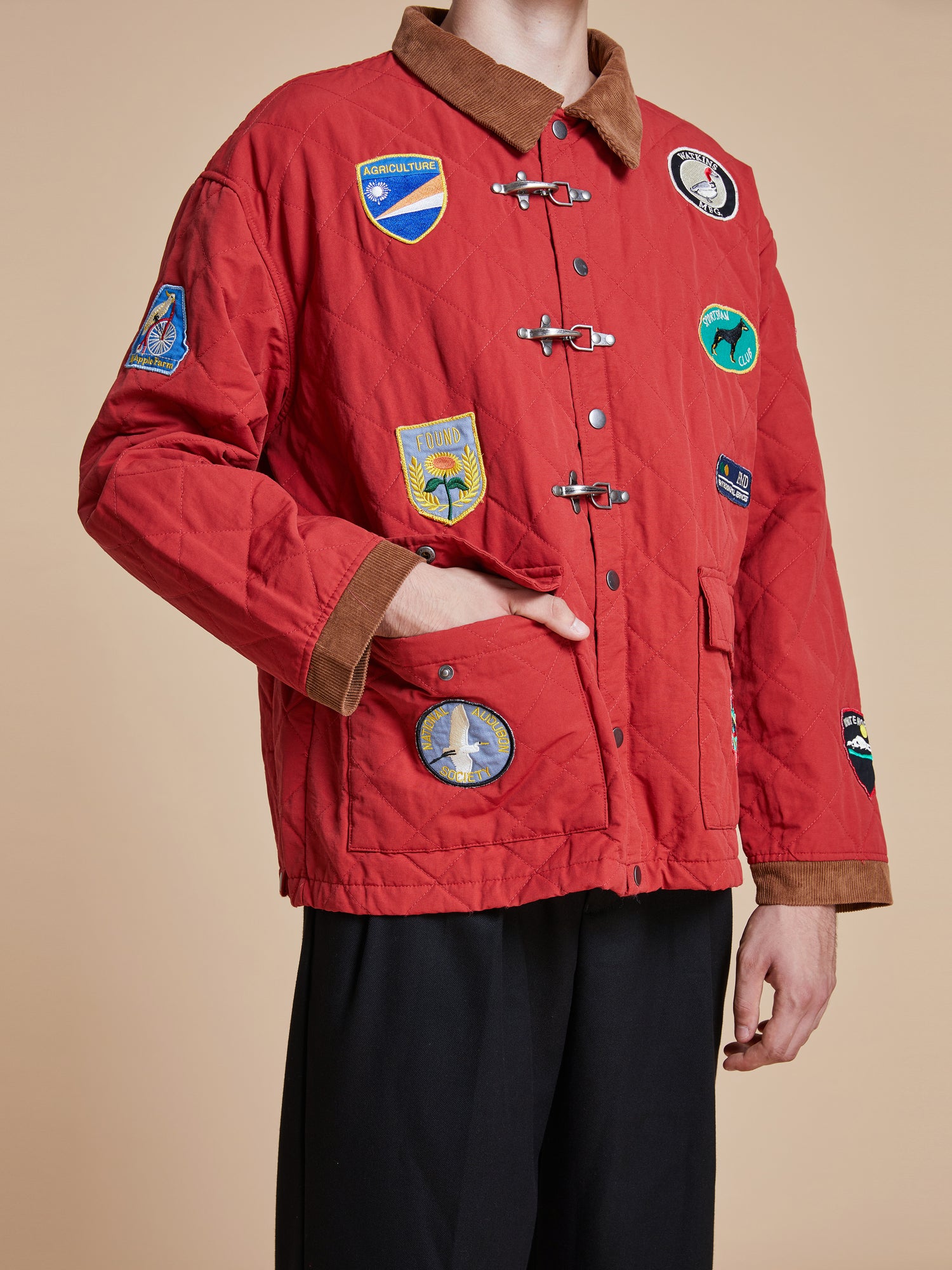 A man wearing a Found Farmstead Quilt Patch Jacket.