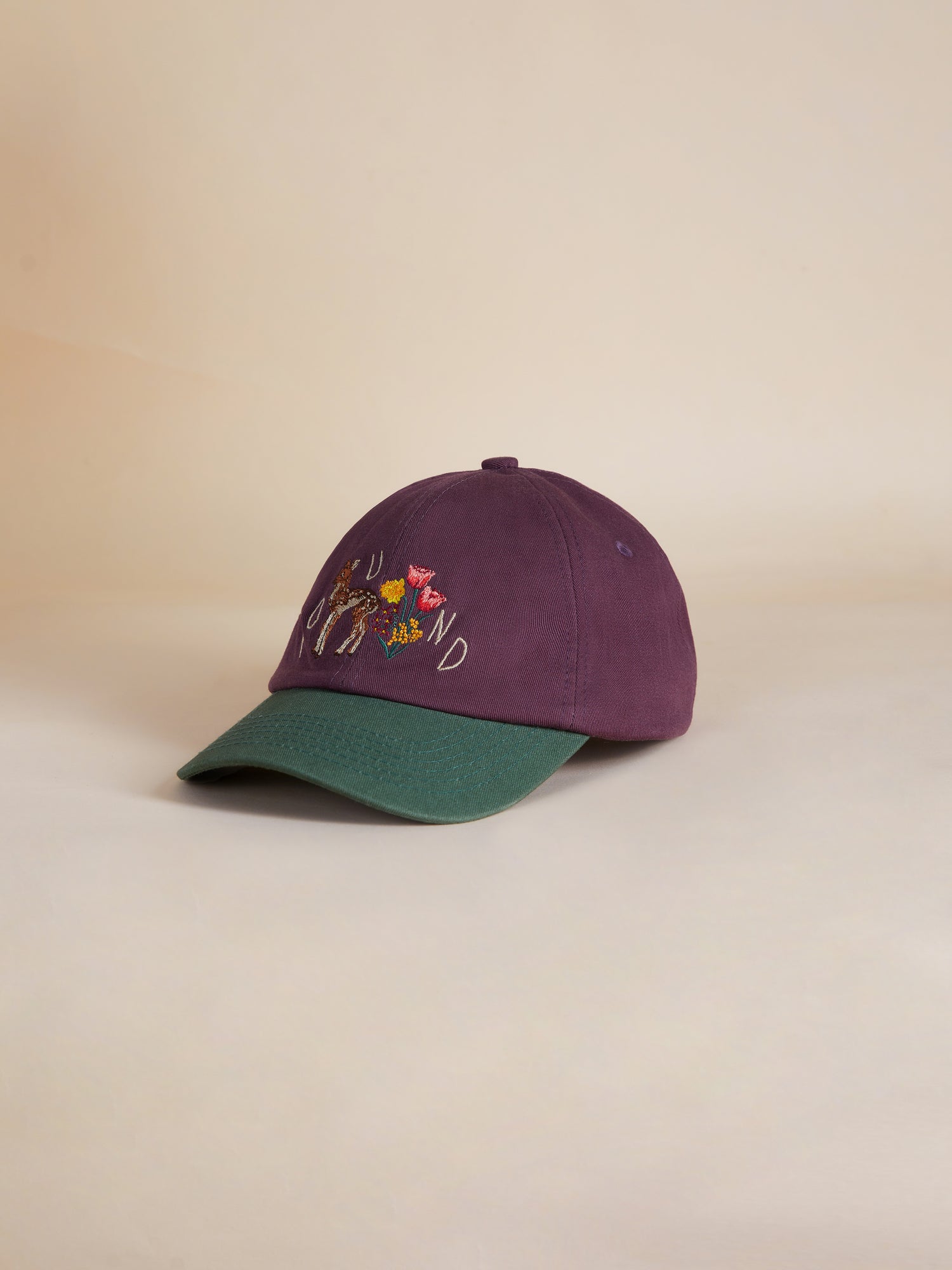 A Flower Deer Cap with an embroidered flower on it. (Found)