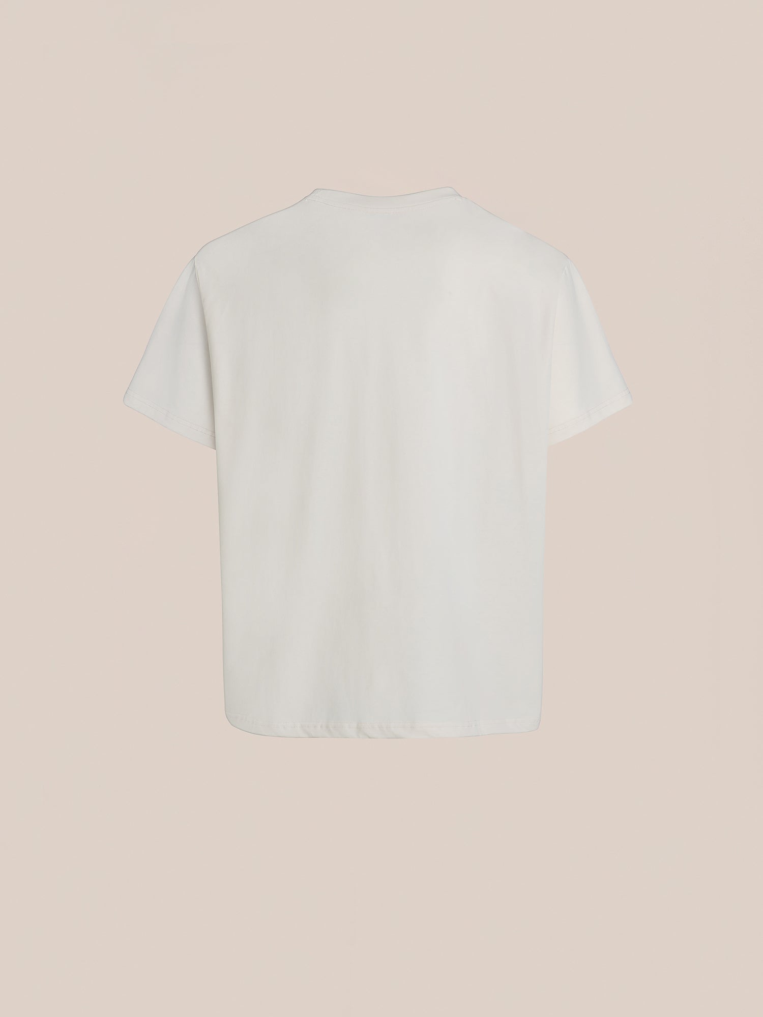 The "Urdu Graphic Tee" by FOUND is showcased against a beige backdrop, crafted from 100% cotton. The back view features a straightforward design that quietly exudes timeless elegance.