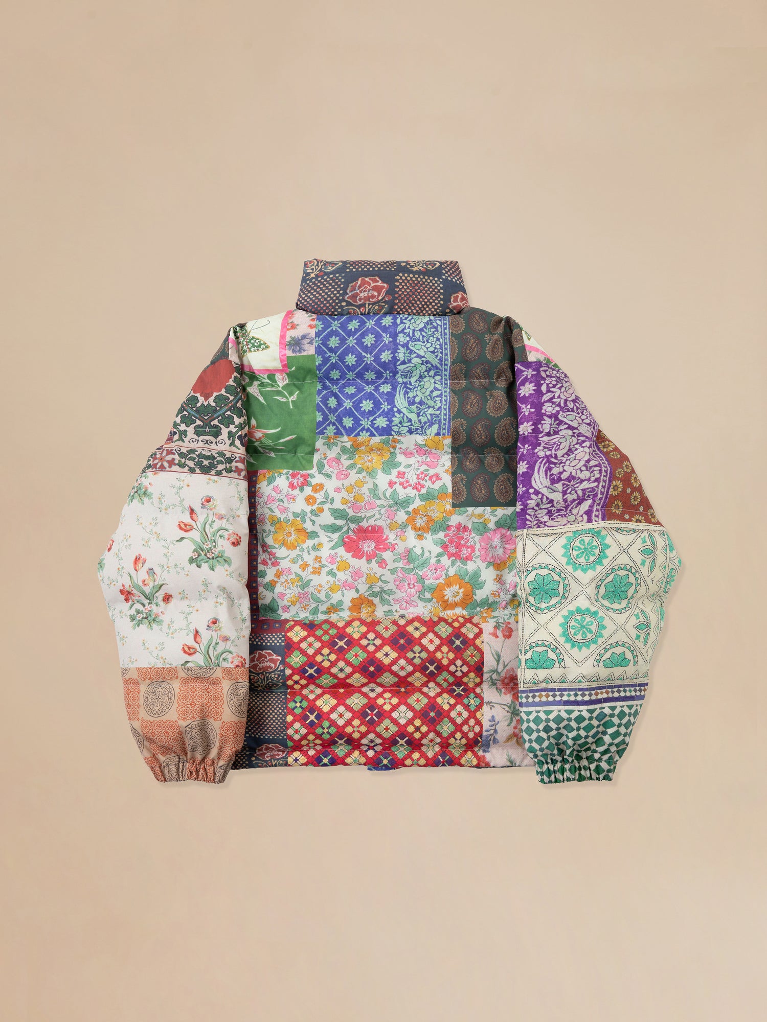 Found Gardenia Tapestry Puffer Jacket with traditional South Asian prints.