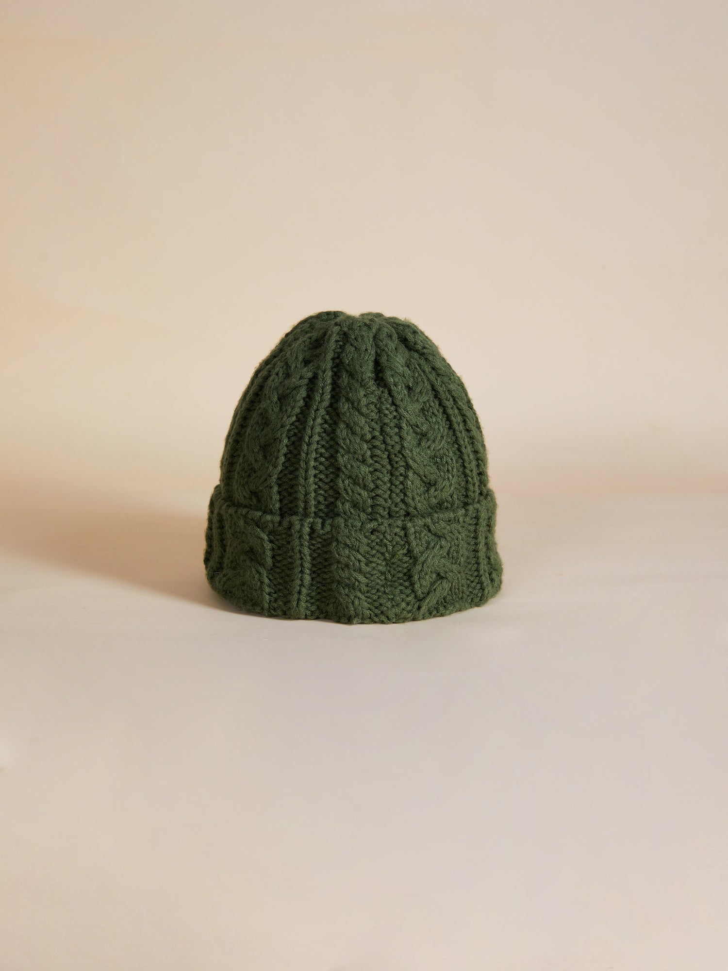 A Forest Cable Knit Beanie by Profound on a white background.