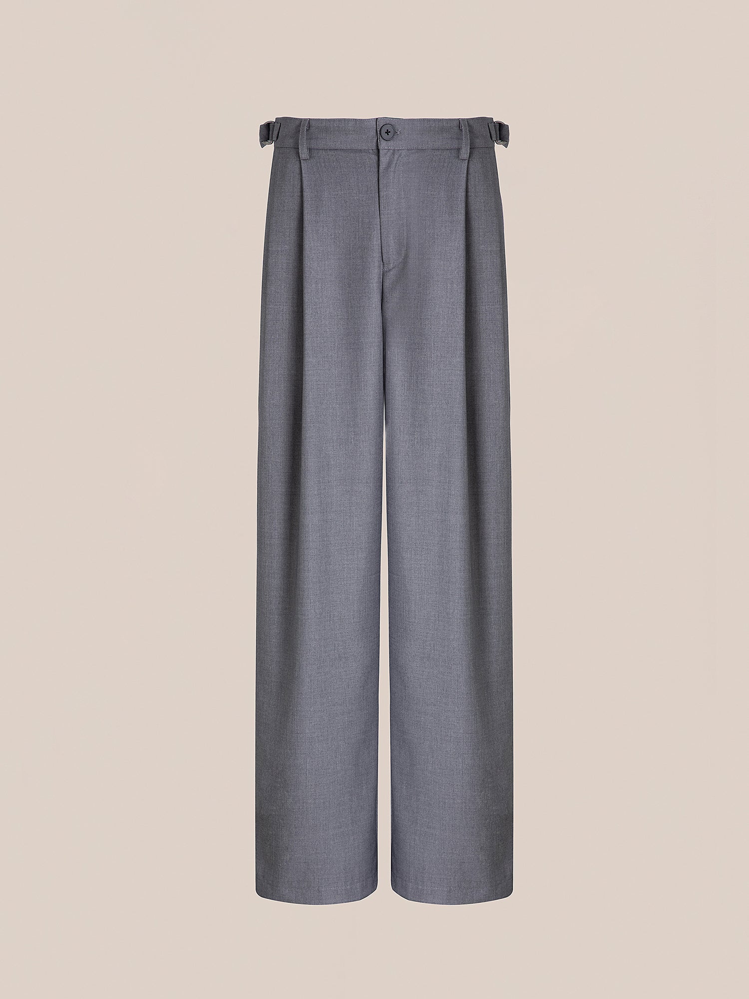 The Pleated Trousers by FOUND are gray high-rise wide-leg trousers that feature a button and buckle detail at the waist, enhanced by adjustable waist tabs. Displayed against a plain background, these trousers offer style and functionality in one sleek design.