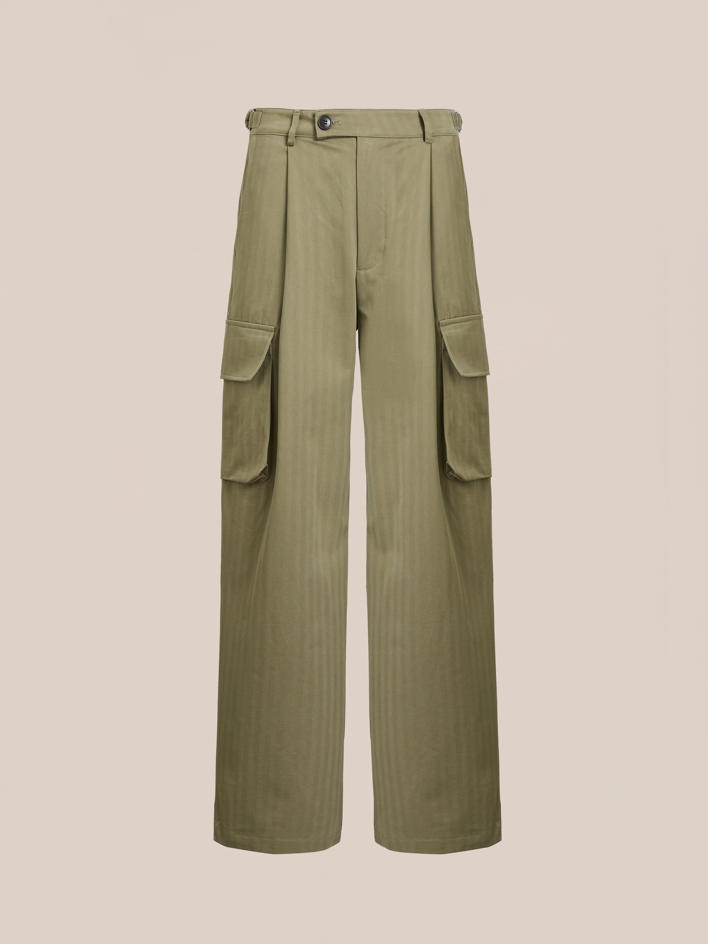 FOUND's Hava Herringbone Pleated Cargo Trousers feature a button closure, side pockets, and belt loops in a wool-blend for utility wear, displayed against a neutral background.