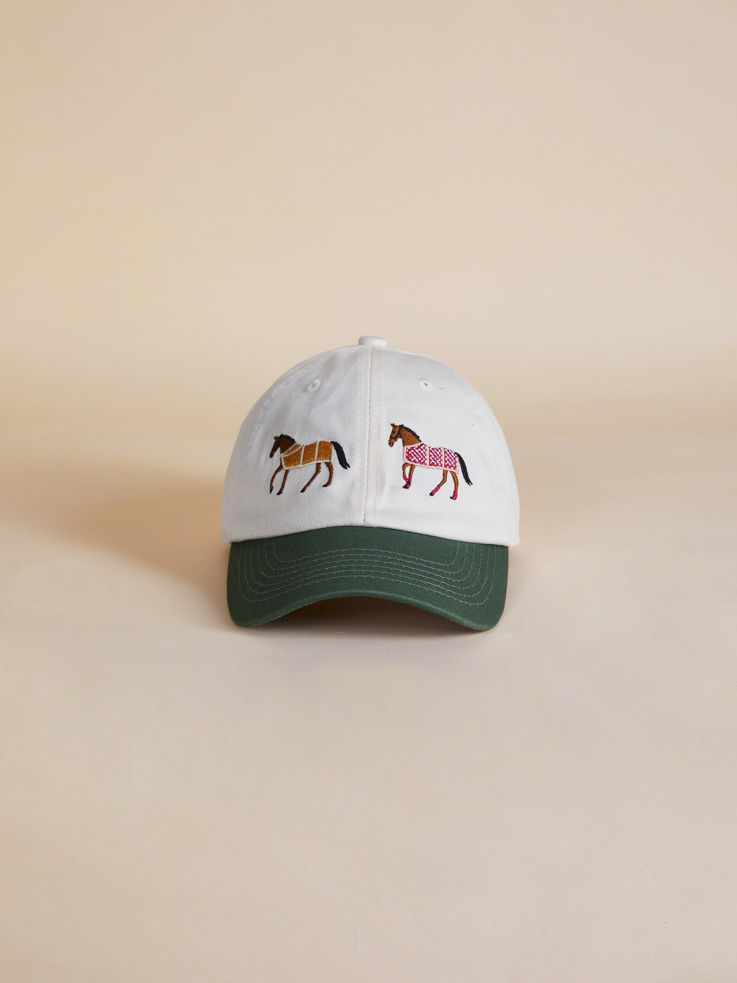 A Found Horse Equine Cap with two horses on it.
