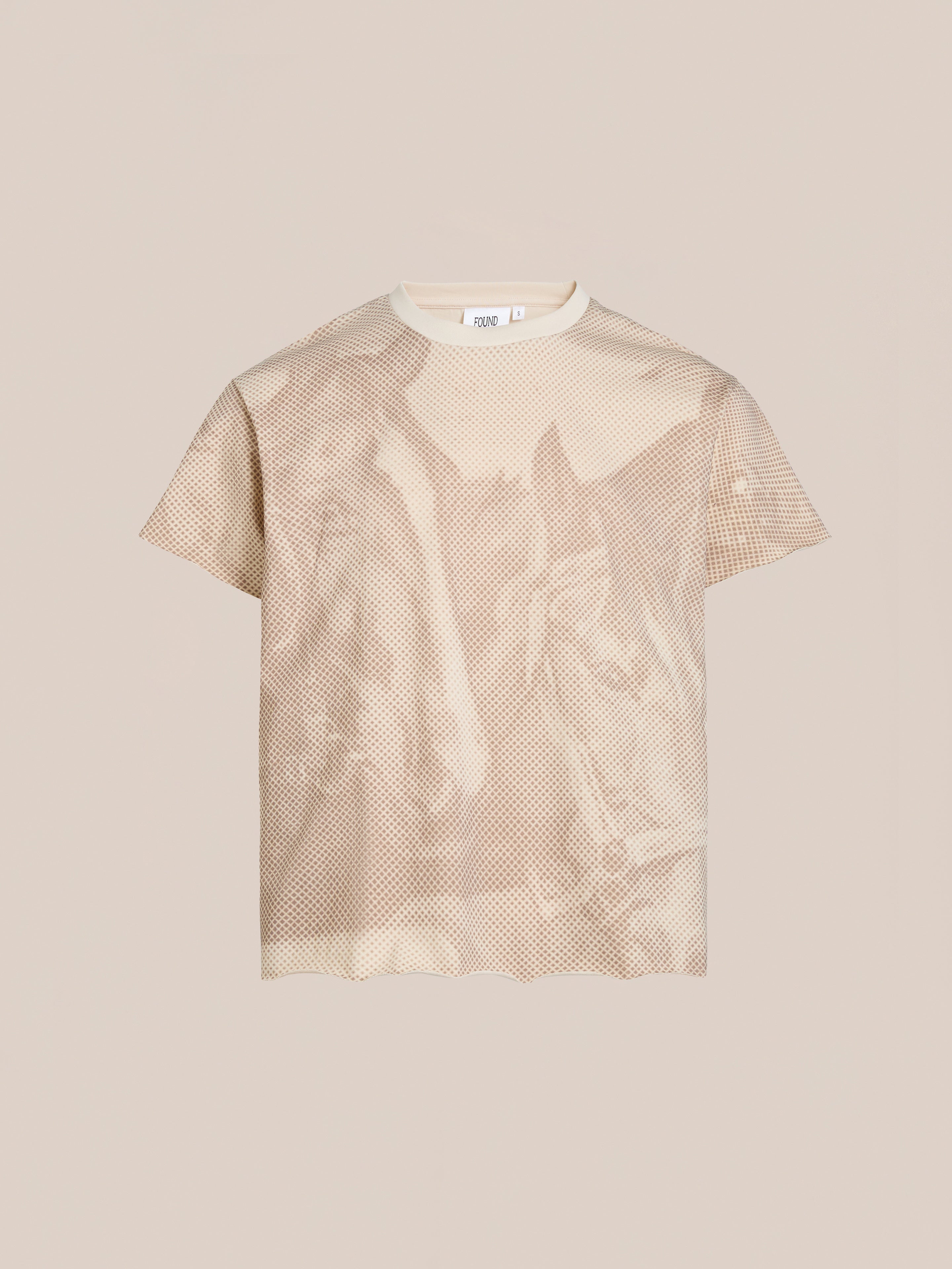 The Horse Racer Tee by FOUND is a relaxed-fit beige T-shirt showcasing a photo print of two individuals amidst an equestrian heritage landscape.