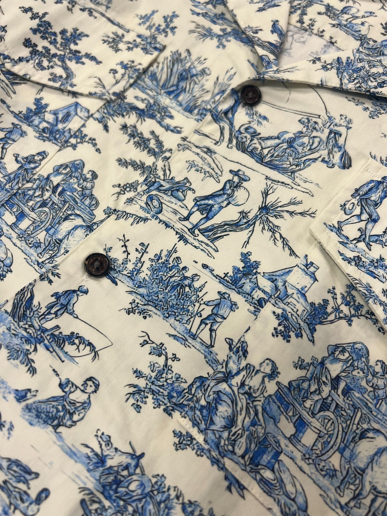 A 100% cotton shirt with a blue and white toile print, the Profound Sample 65 (Porcelain Camp Shirt).