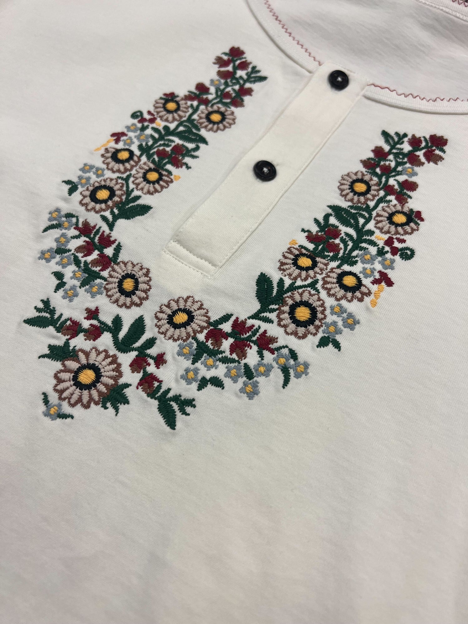 A white shirt with the Profound Sample 46 (Floral Embroidered Henley)