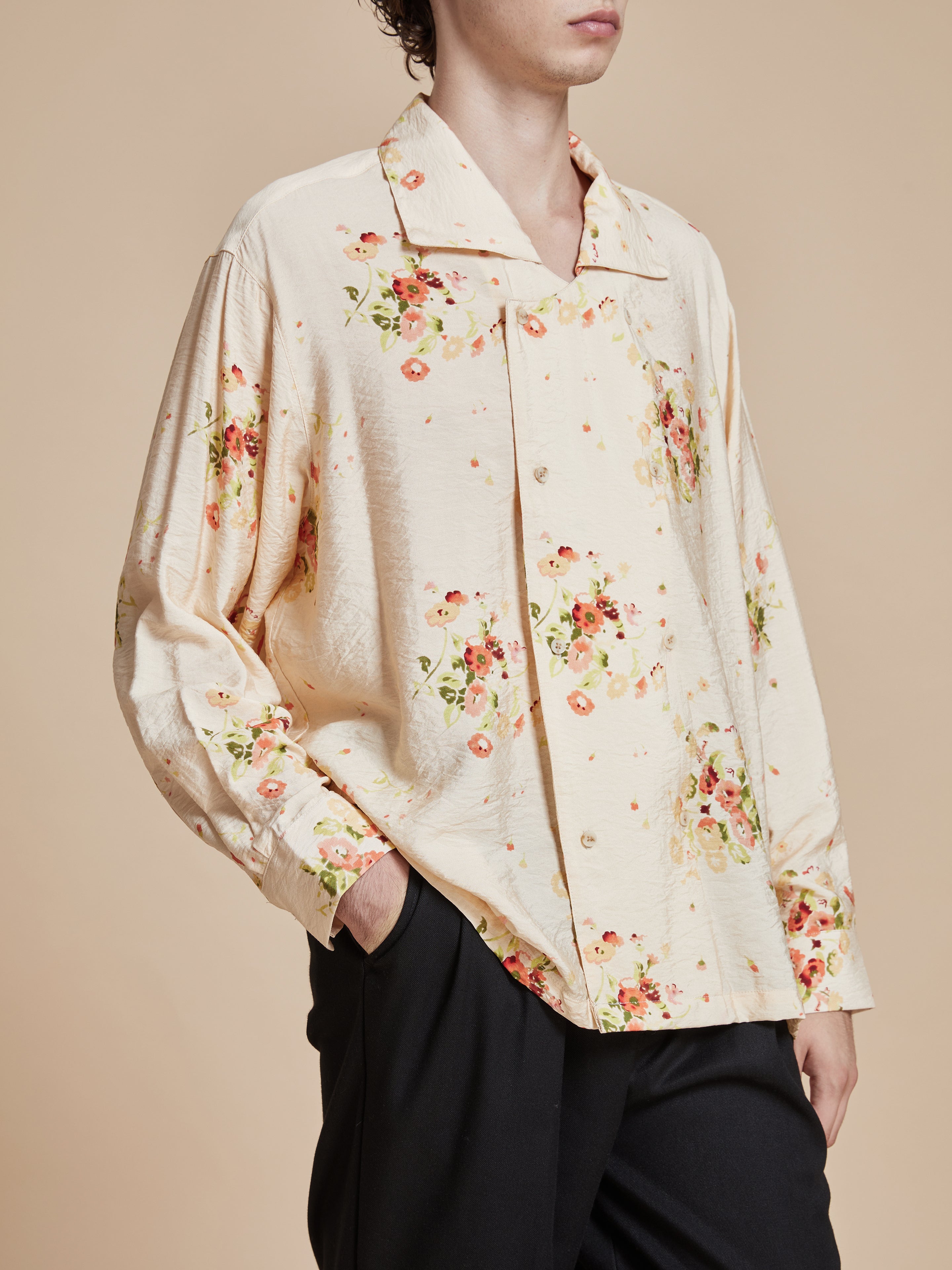 A model wearing the Found Kanhati Garden Long Sleeve Camp Shirt with Phulkari motifs.