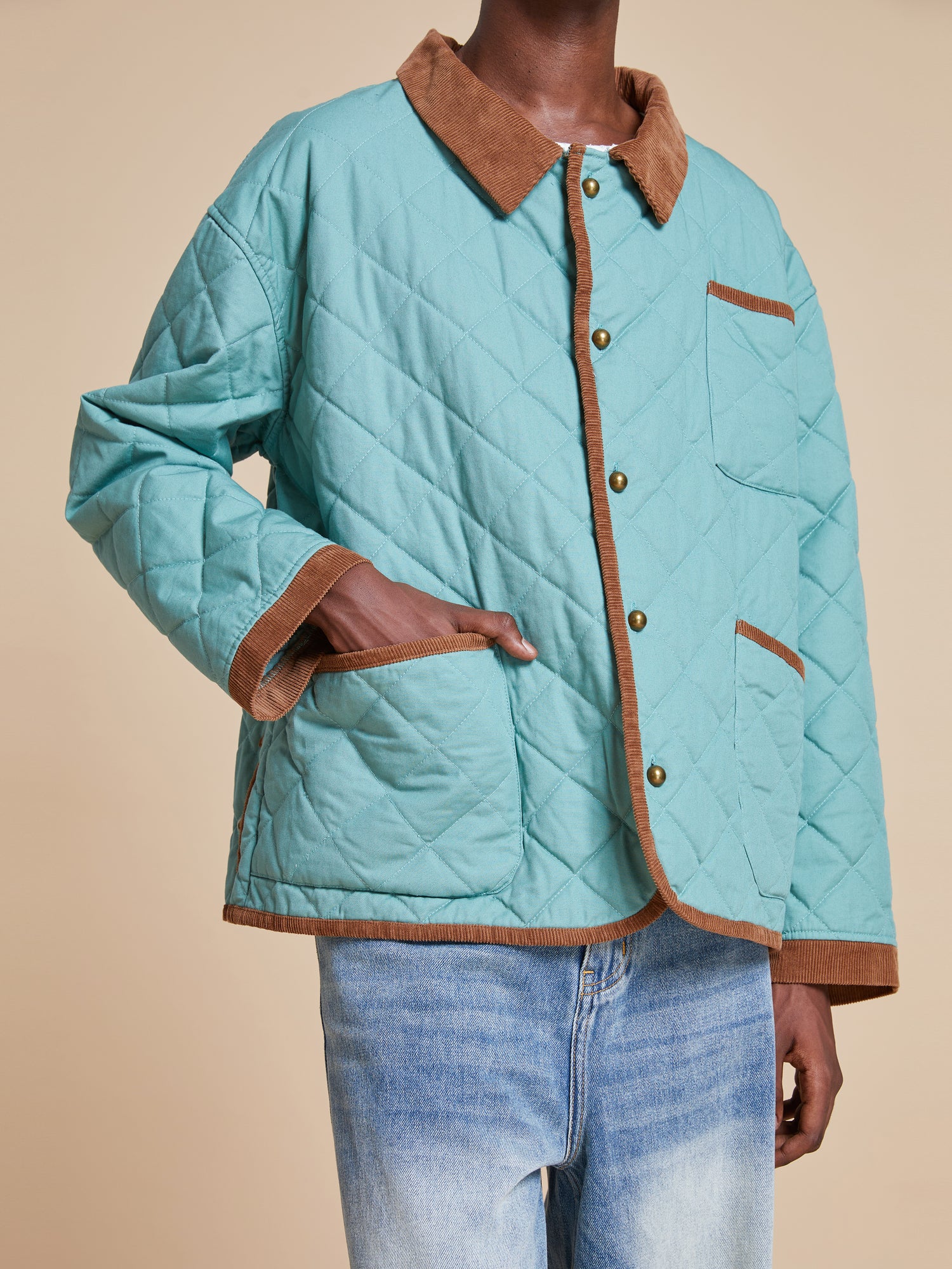 Male model wearing the Kashmir Meadow Quilt Jacket from Found's Fall 2023 collection