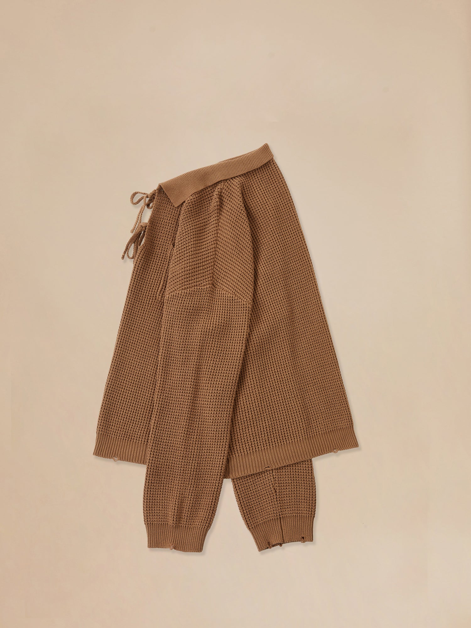Cozy ginger-colored Found Tie-Collar Knit Sweater and pants for a child.