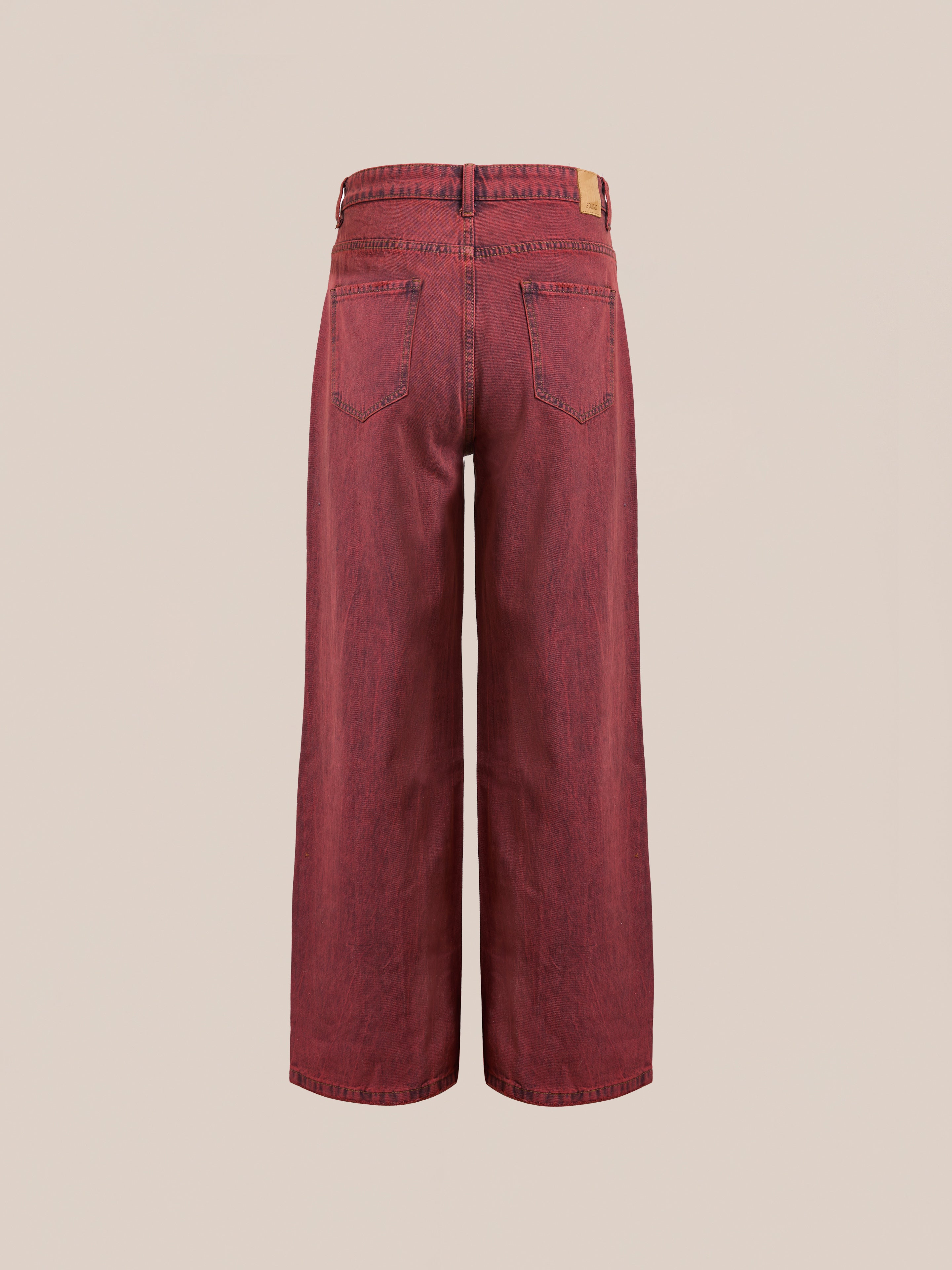 Back view of Lacy Baggy Jeans by FOUND, featuring a wide-leg design in vintage red wash denim made from 100% cotton, with two back pockets against a plain background.