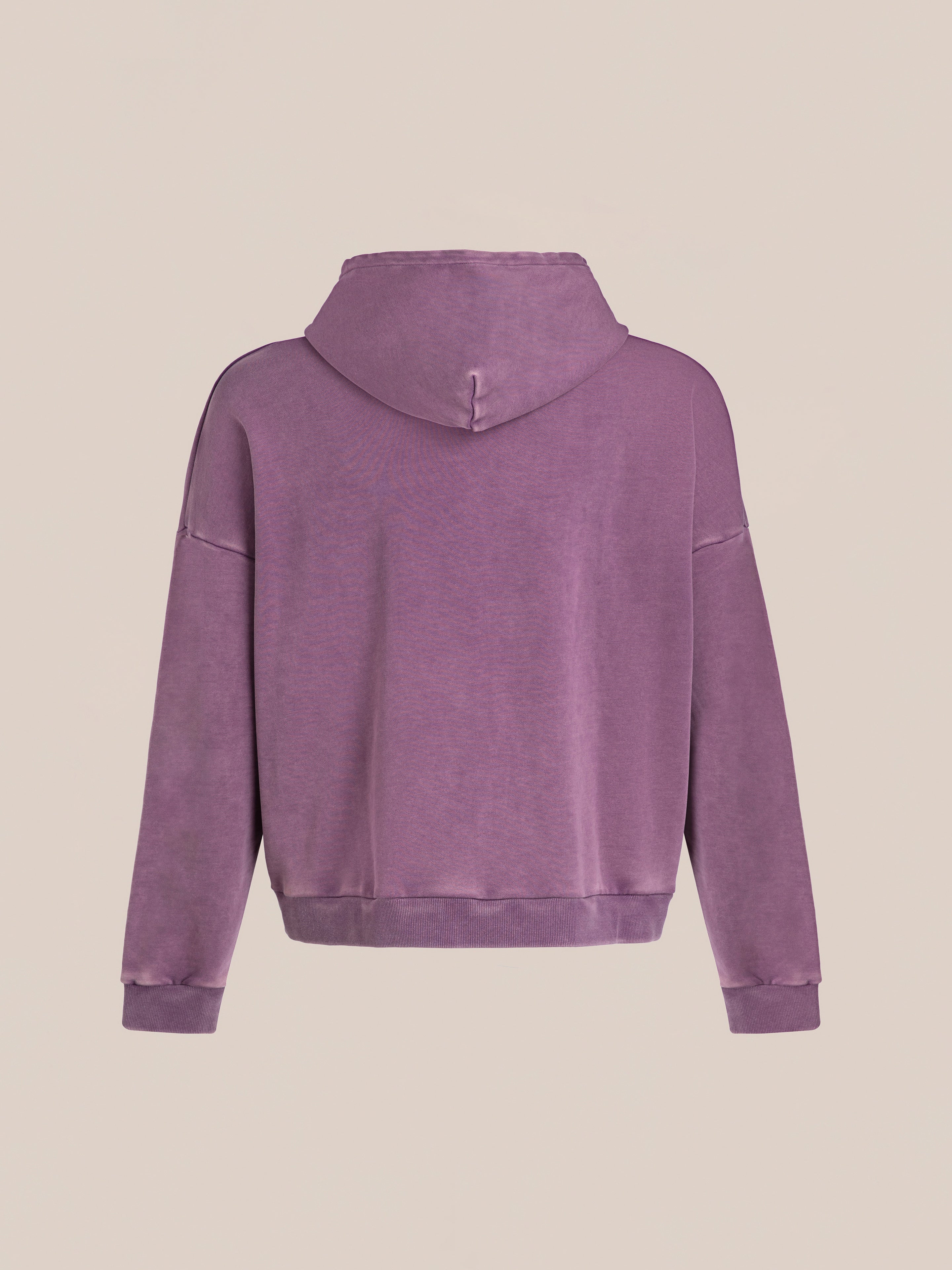 Back view of FOUND's lavender Motif Zip-Up Hoodie, featuring a hood, long sleeves, and a loose fit, set against a beige background; this streetwear essential is a stylish statement.