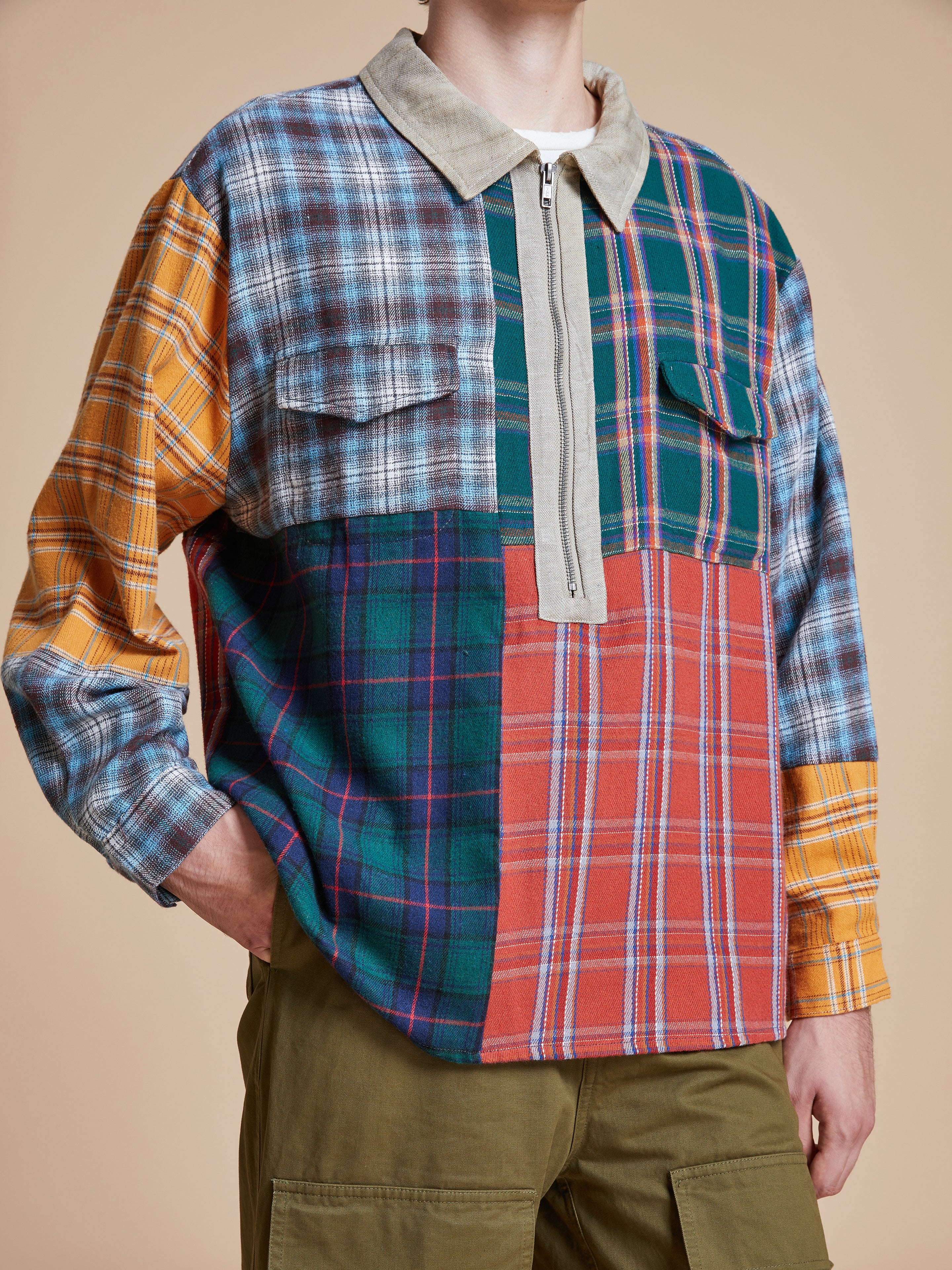 A man wearing a Found Multi Plaid Tartan Shirt.