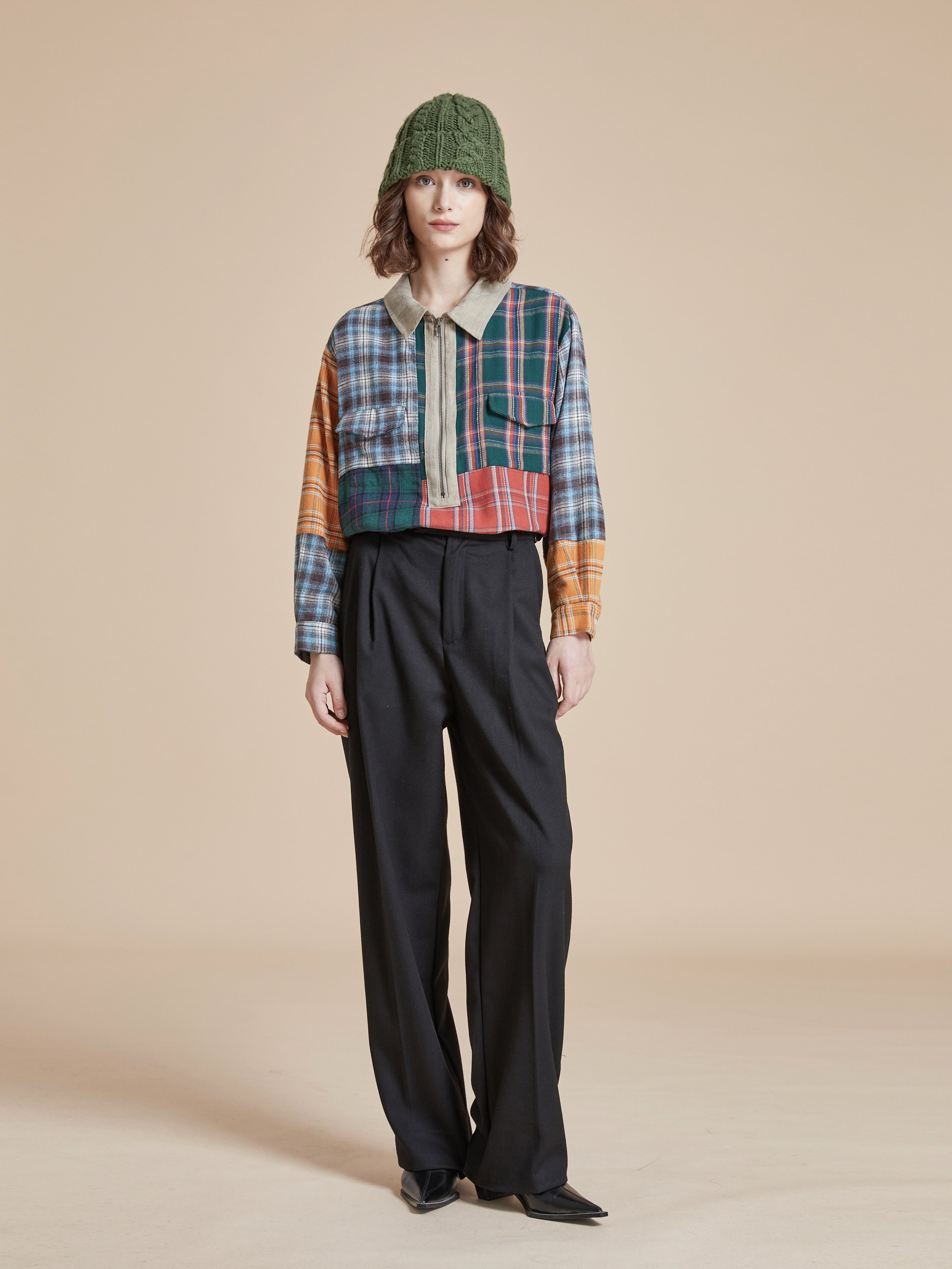 A woman wearing a distressing Multi Plaid Tartan Shirt by Found.