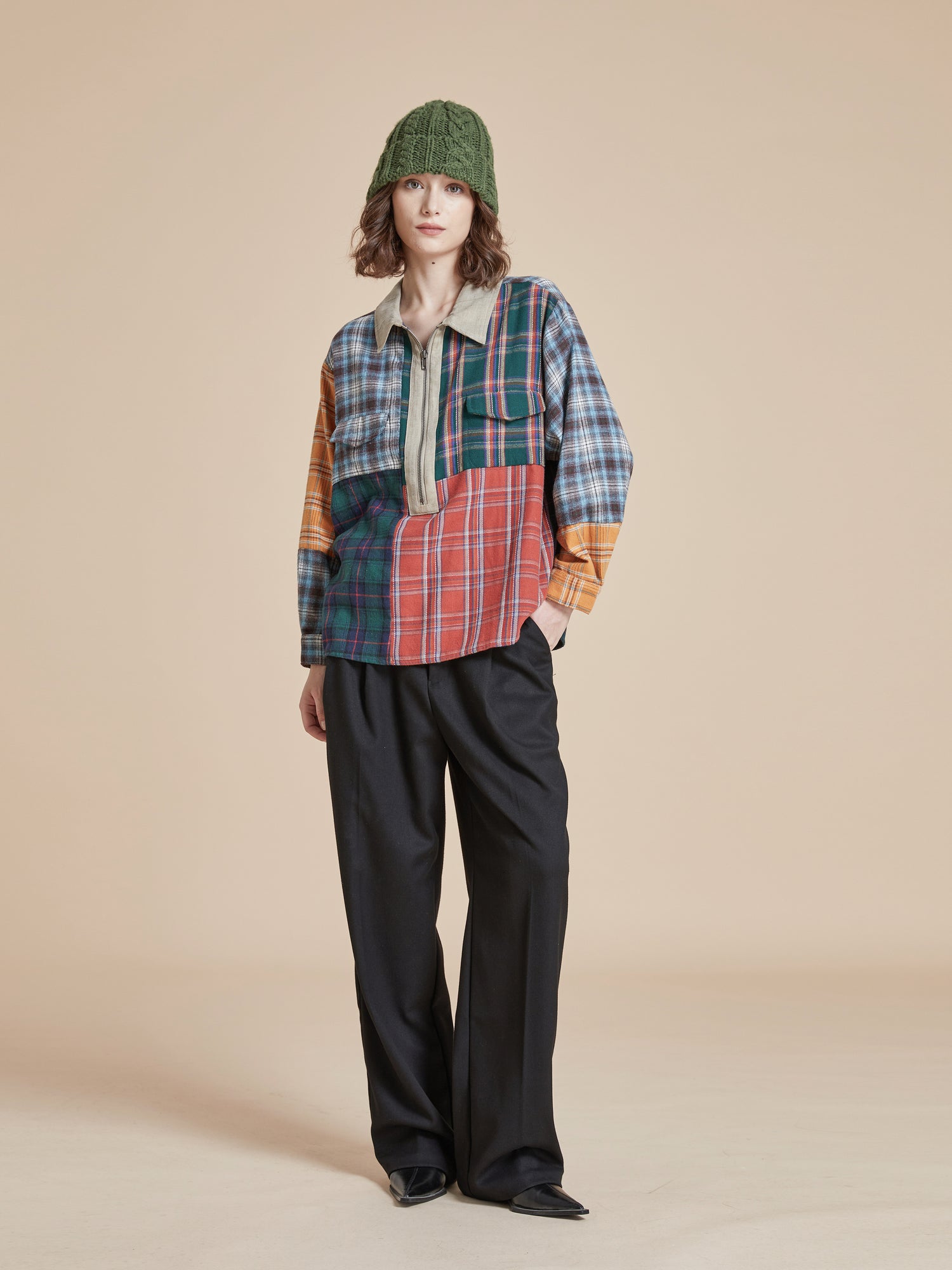 A model wearing a Multi Plaid Tartan Shirt by Found in handcrafted distressing.
