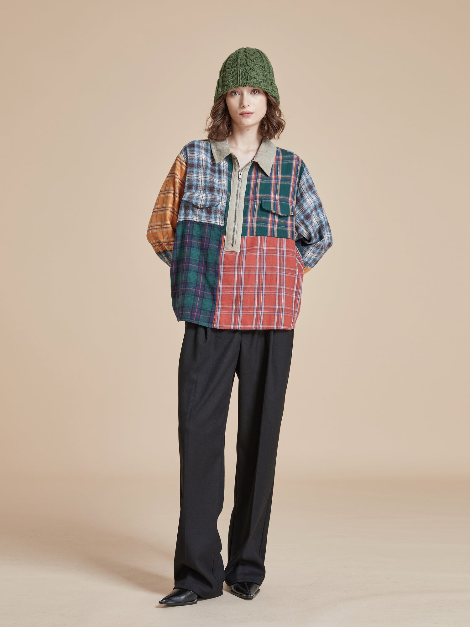 A model wearing a handcrafted Found Multi Plaid Tartan Shirt and pants.