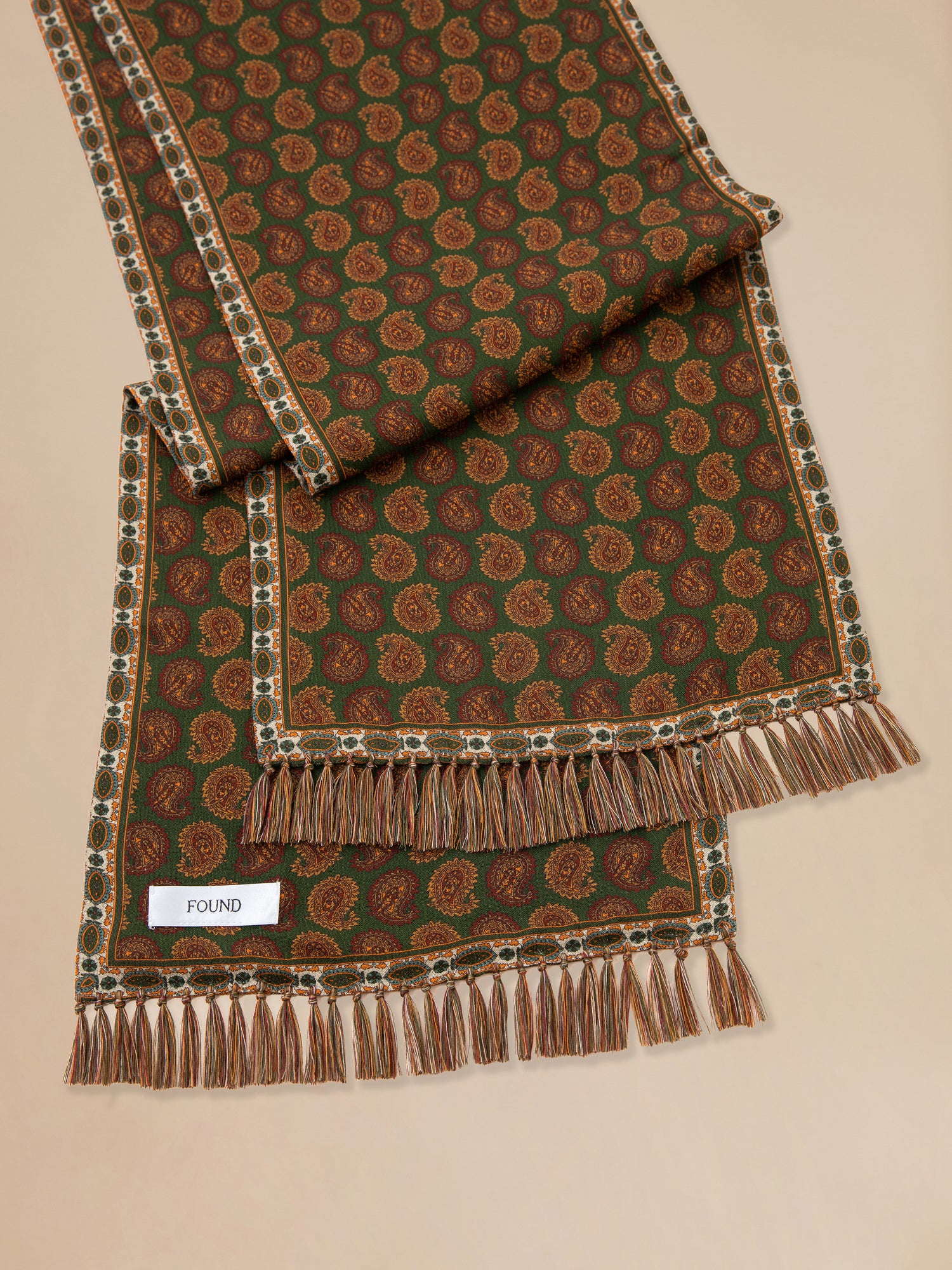 A Paisley Forest Scarf with fringes on it by Found.