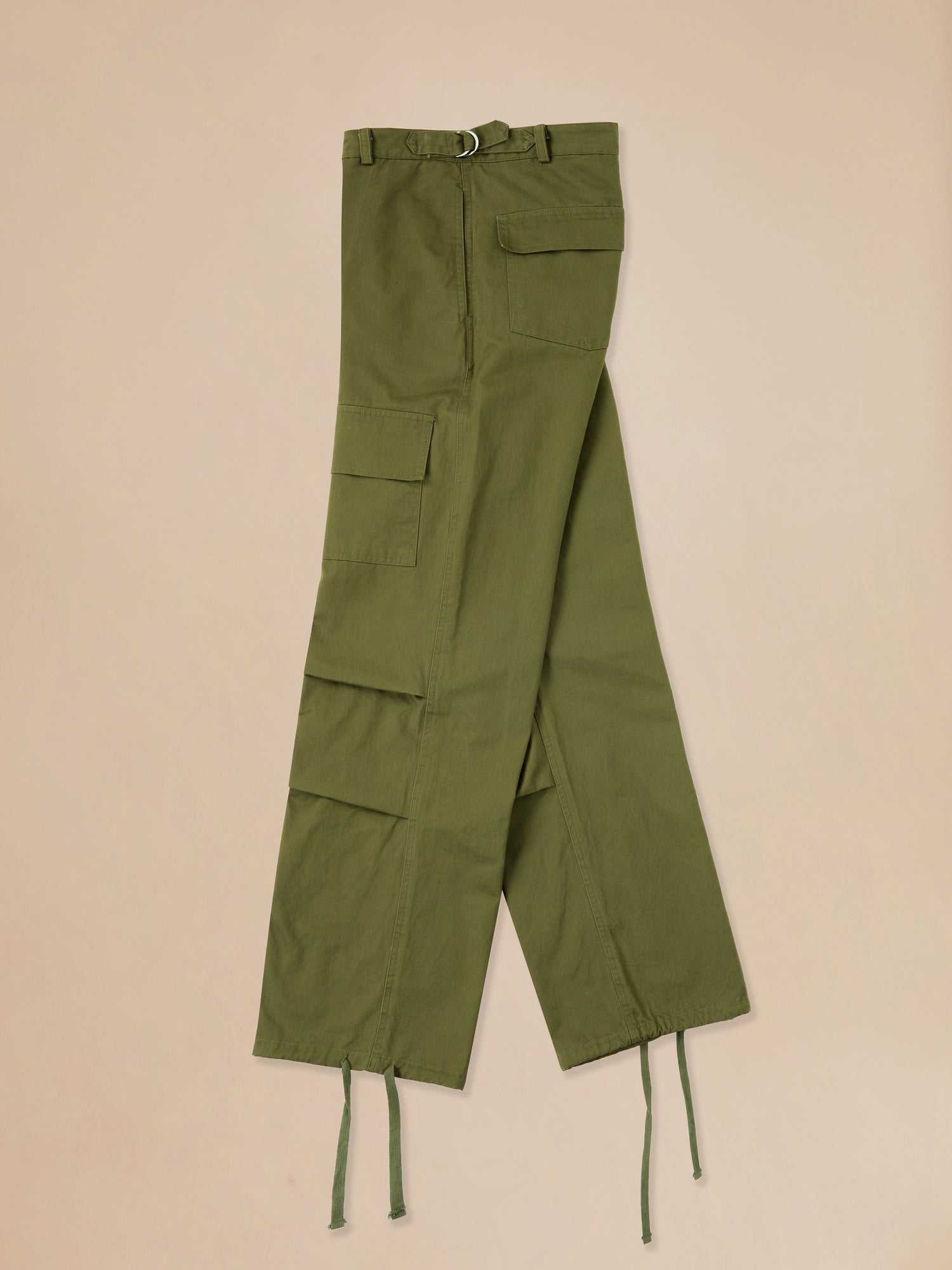 A pair of Found Parachute Cargo Twill Pants on a beige background.