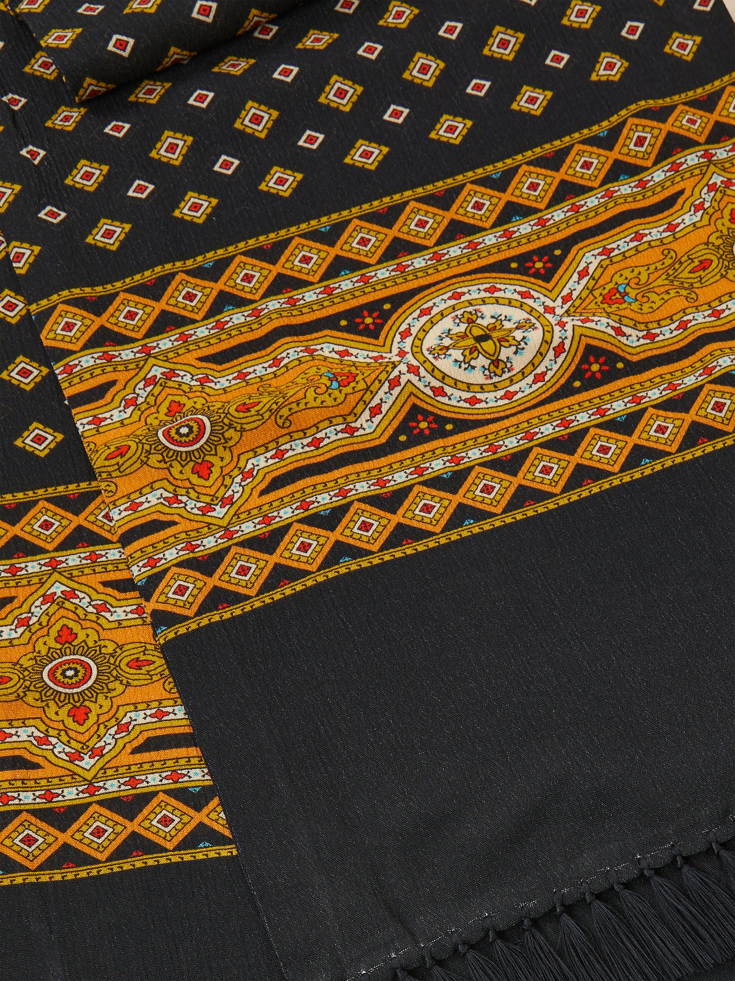 A Pastures Print Scarf with an ornate Indo-Aryan prints, hand-tied tassels, by Found.