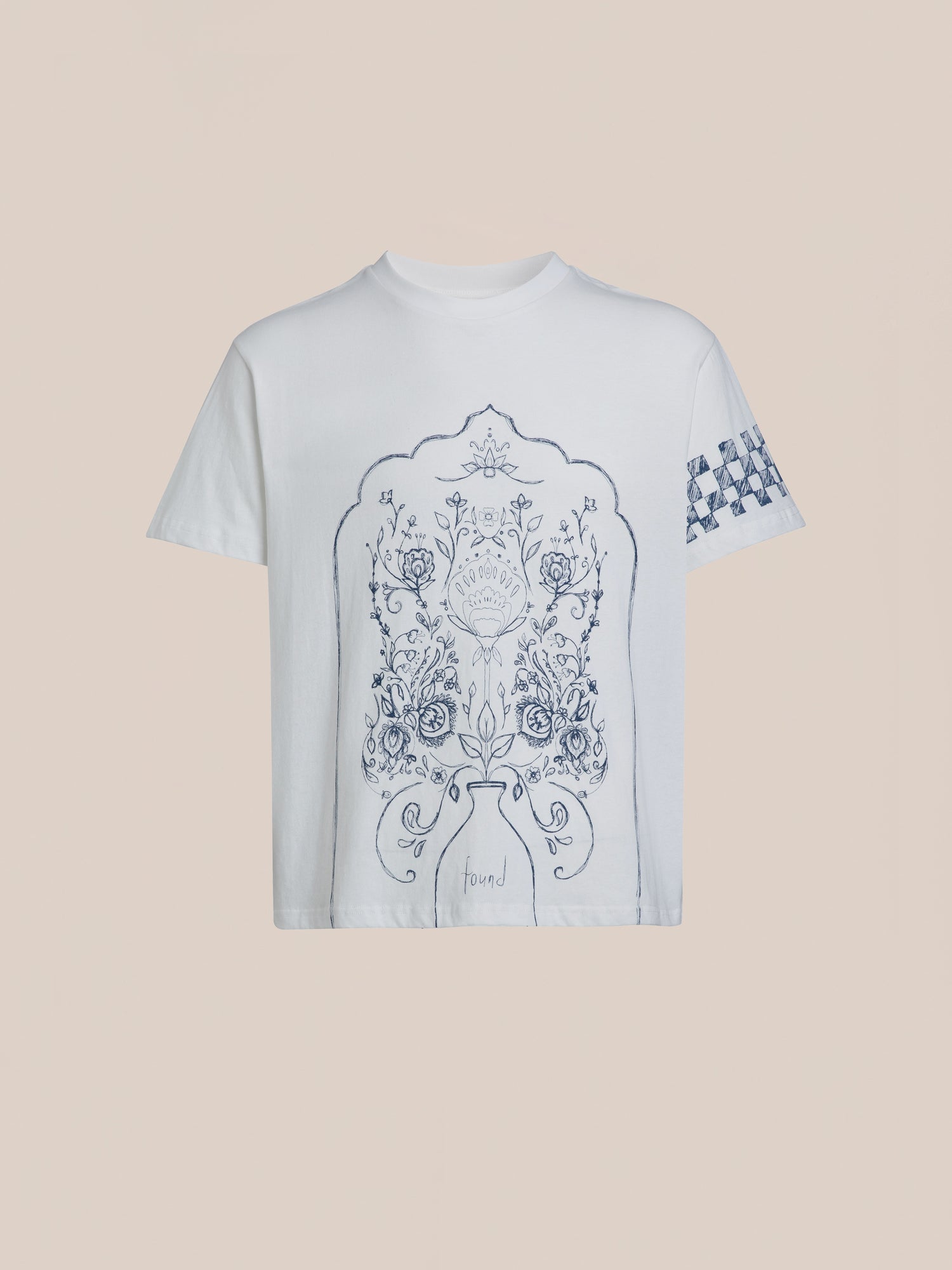 Introducing the Pen Flower Medley White T-shirt by FOUND, showcasing an intricate dark blue floral design on the front and a small checkered pattern on one sleeve against a plain background.