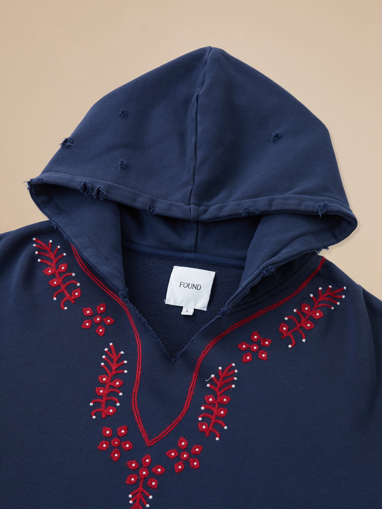 A Found Indus Embroidered Hoodie with red embroidery.