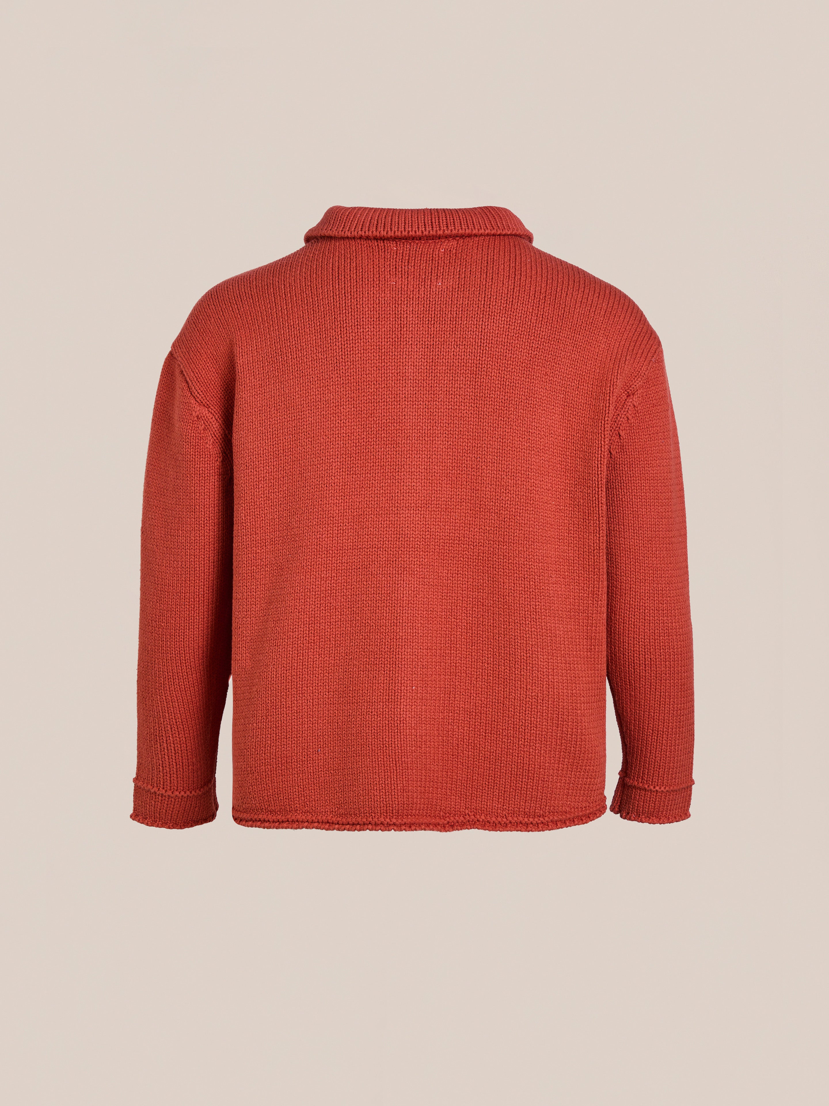 The Hunter Knit Collared Cardigan by FOUND is a red heavy-knit cotton sweater with long sleeves, shown from the back against a plain backdrop. Ideal for transitional layering.